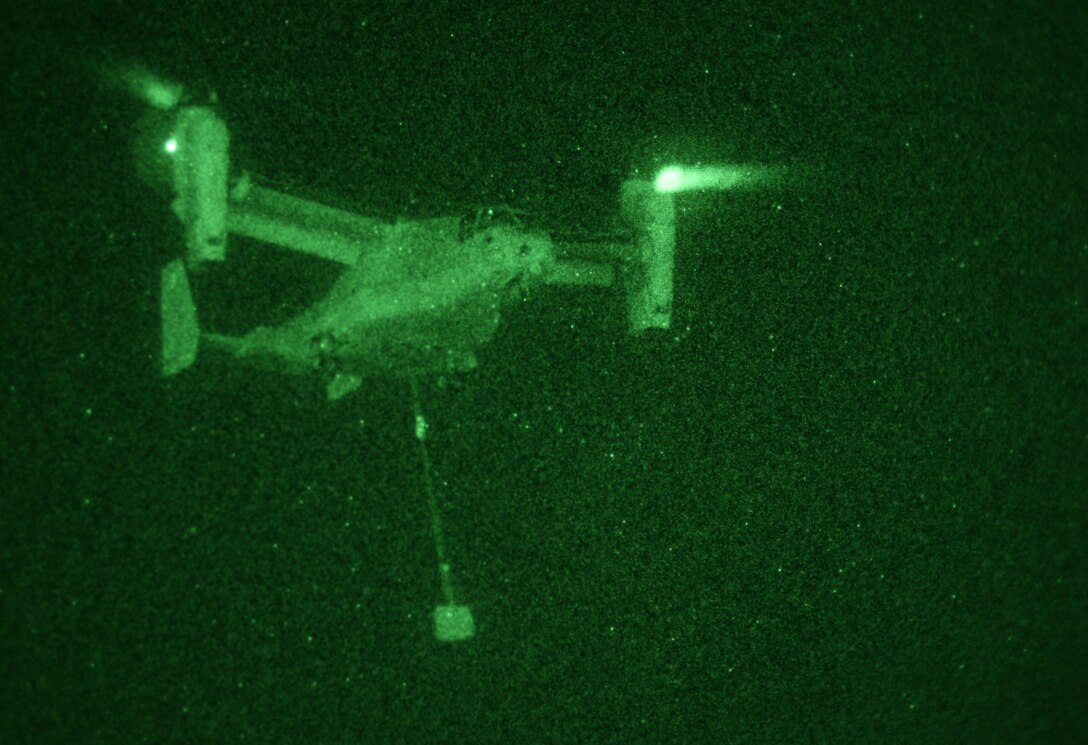 An MV-22B Osprey from Marine Medium Tiltrotor Squadron 263 (Reinforced), 22nd Marine Expeditionary Unit, carries a two-ton barrier during a Helicopter Support Team airlift training evolution at Udairi Army Airfield, Kuwait Aug. 30, 2009. The 22nd MEU is ashore in Kuwait conducting sustainment training while serving as the theater reserve force for U.S. Central Command.