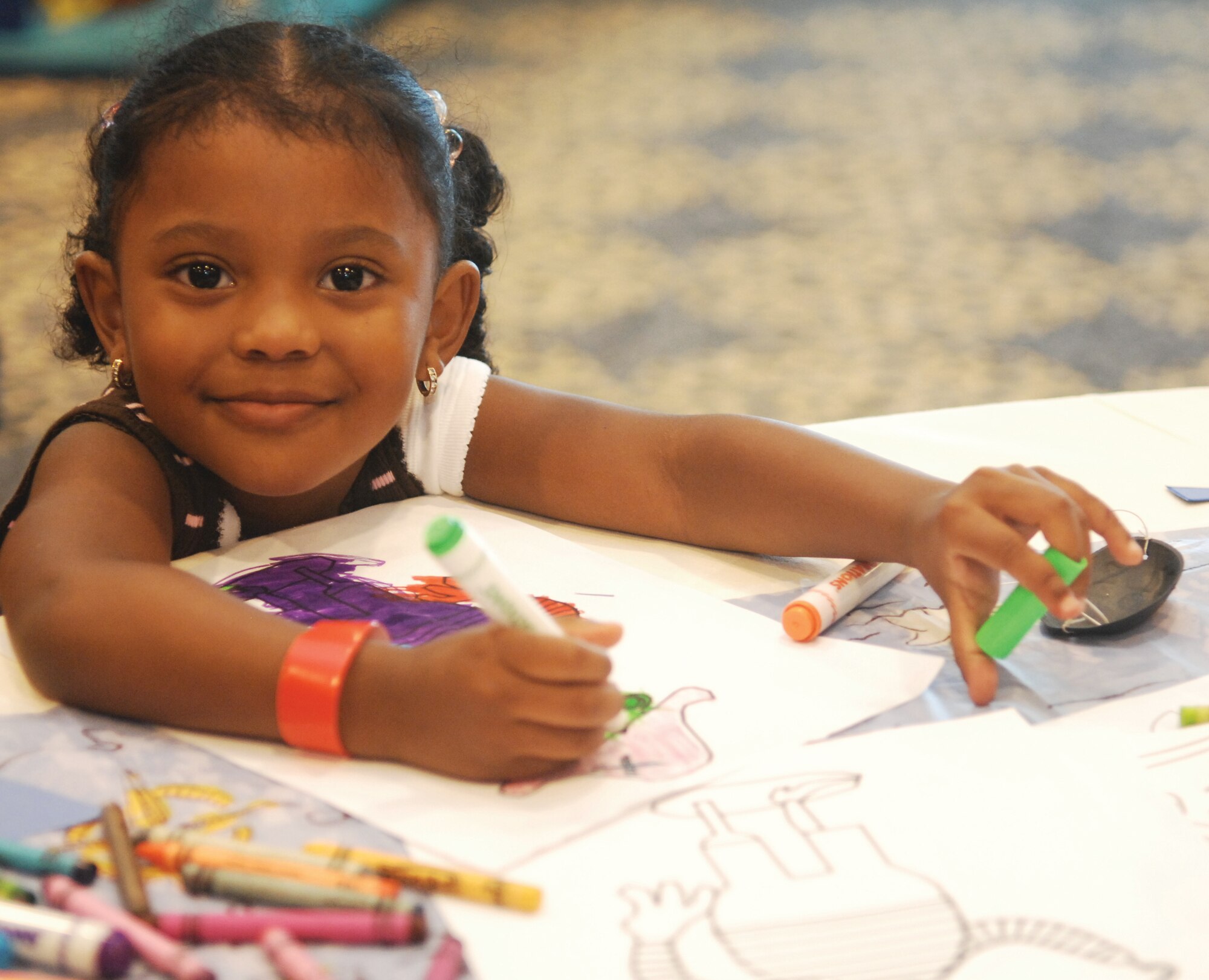 The younger family members forgot about their parents as they became absorbed in a variety of activities at the child care center. The teens battled each other with Wii video games of tennis, bowling and baseball. The school age children enjoyed arts and crafts, watching “Ice Age,” searching for buried treasure as pirates, sack races and assorted board games. The infants took pleasure in the individual attention and the multi-sensory toys. (U. S. Air Force photos by Tech. Sgt. Michele Desrochers and Tech. Sgt. Carolyn Erfe)