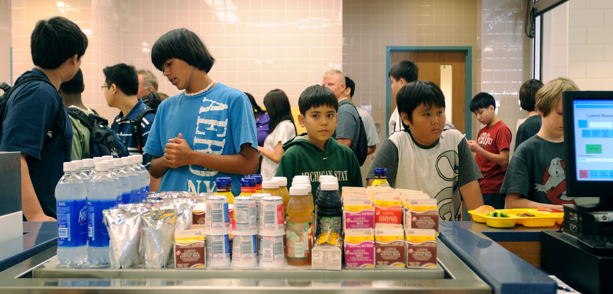 Osan Middle School students wait to pay for lunch on the first day of school, Aug 31. The school is a new addition to Osan Air Base, with more than 140 students enrolled in grades 6-8.   (U.S. Air Force photo/Staff Sgt. Brian Ferguson)
