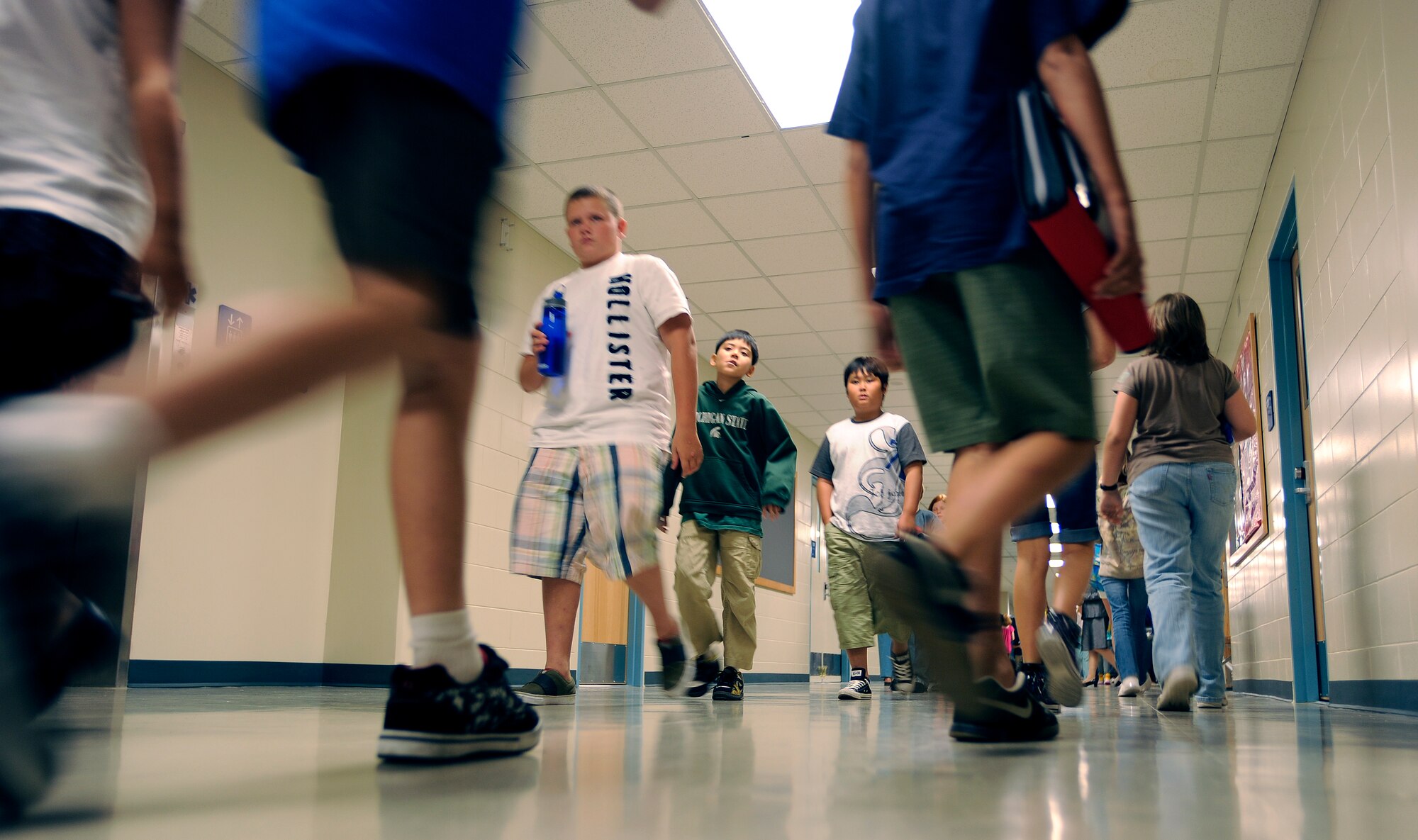 Students walk to their lockers before lunch on the first day of school at Osan Middle School Aug 31. The school is a new addition to Osan Air Base, with more than 140 students enrolled in grades 6-8.   (U.S. Air Force photo/Staff Sgt. Brian Ferguson)

