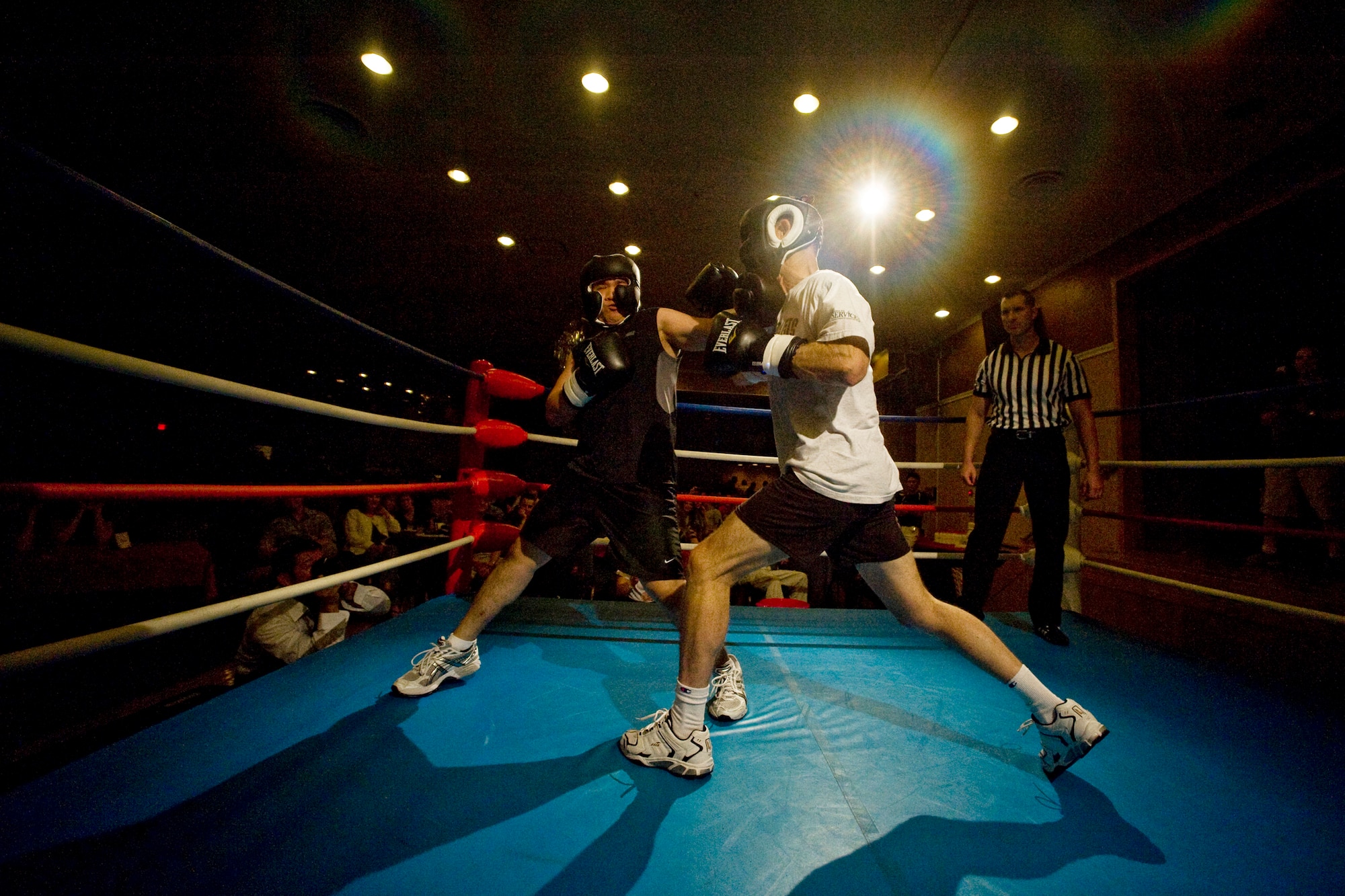 MISAWA AIR BASE, Japan -- Capt. Harold Tongson, 35th Fighter Wing executive officer, and Col. David Stilwell, 35th Fighter Wing commander, square off during a Friday Night Fight Night bout Aug. 28. Colonel Stilwell won the two-round fight bout by decision. (U.S. Air Force photo/Senior Airman Jamal D. Sutter)