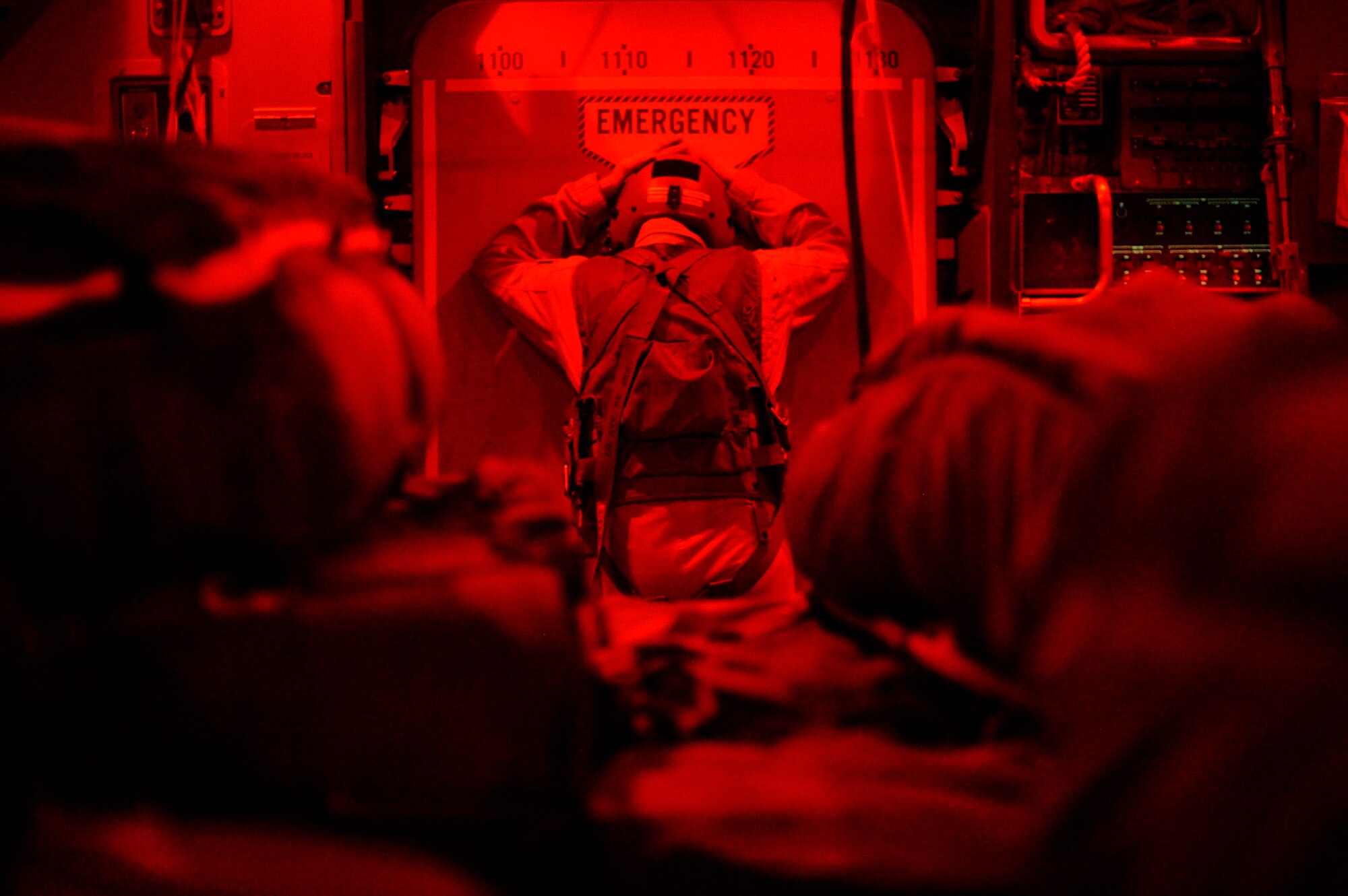 Staff Sgt. Chad Beach watches for threats to the C-17 Globemaster III during an airdrop of supplies for a forward operating base in Afghanistan, Aug. 27, 2009, in support of Operation Enduring Freedom.  Sergeant Beach is a loadmaster with the 817th Expeditionary Airlift Squadron, and deployed from McChord Air Force Base, Wash.  (U.S. Air Force photo/Staff Sgt. Michael B. Keller)
