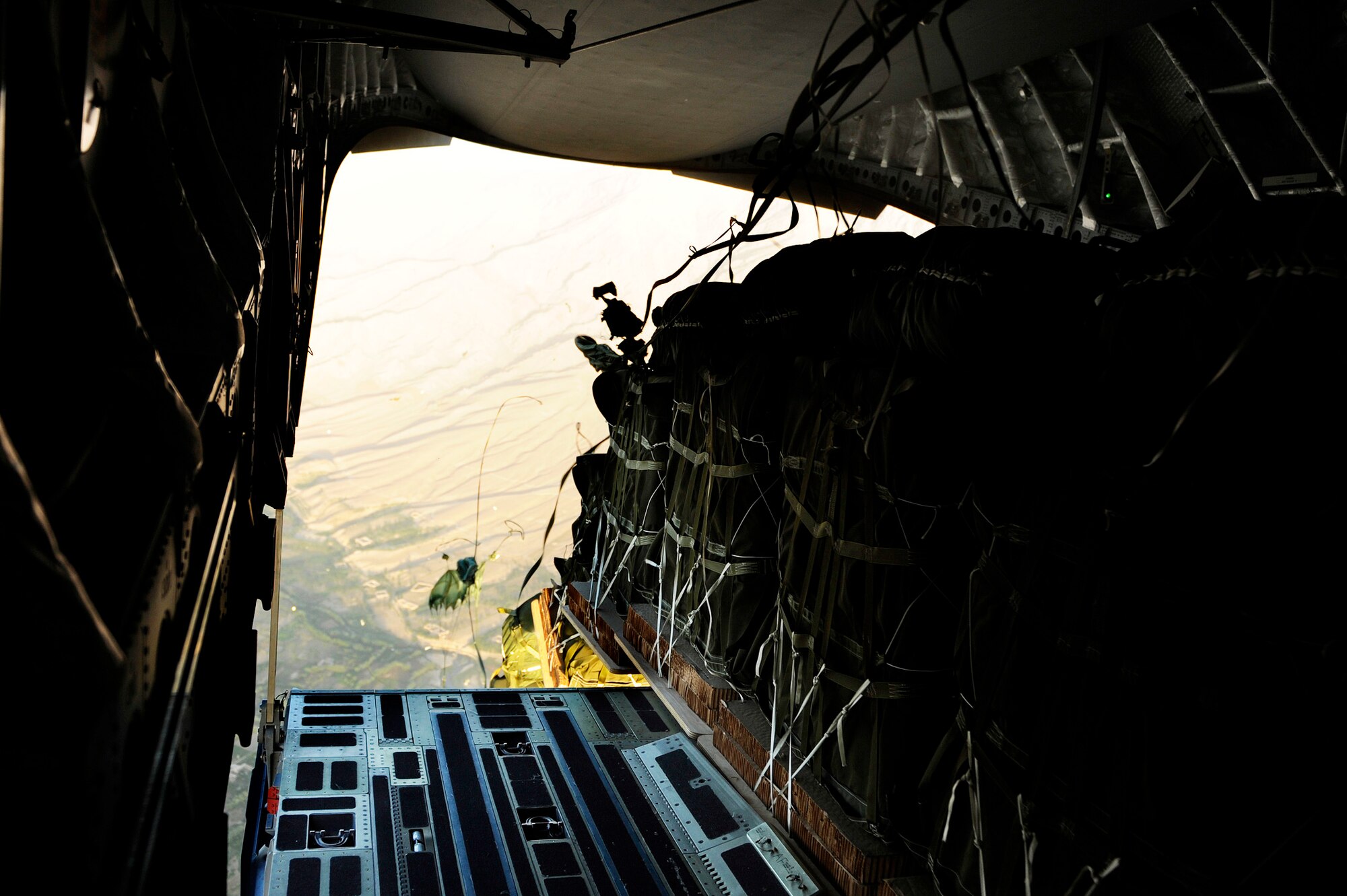 Pallets of cargo drop from a C-17 Globemaster III to a forward operating base in Afghanistan, Aug. 27, 2009, in support of Operation Enduring Freedom.  The aircraft is assigned to the 817th Expeditionary Airlift Squadron. (U.S. Air Force photo/Staff Sgt. Michael B. Keller)