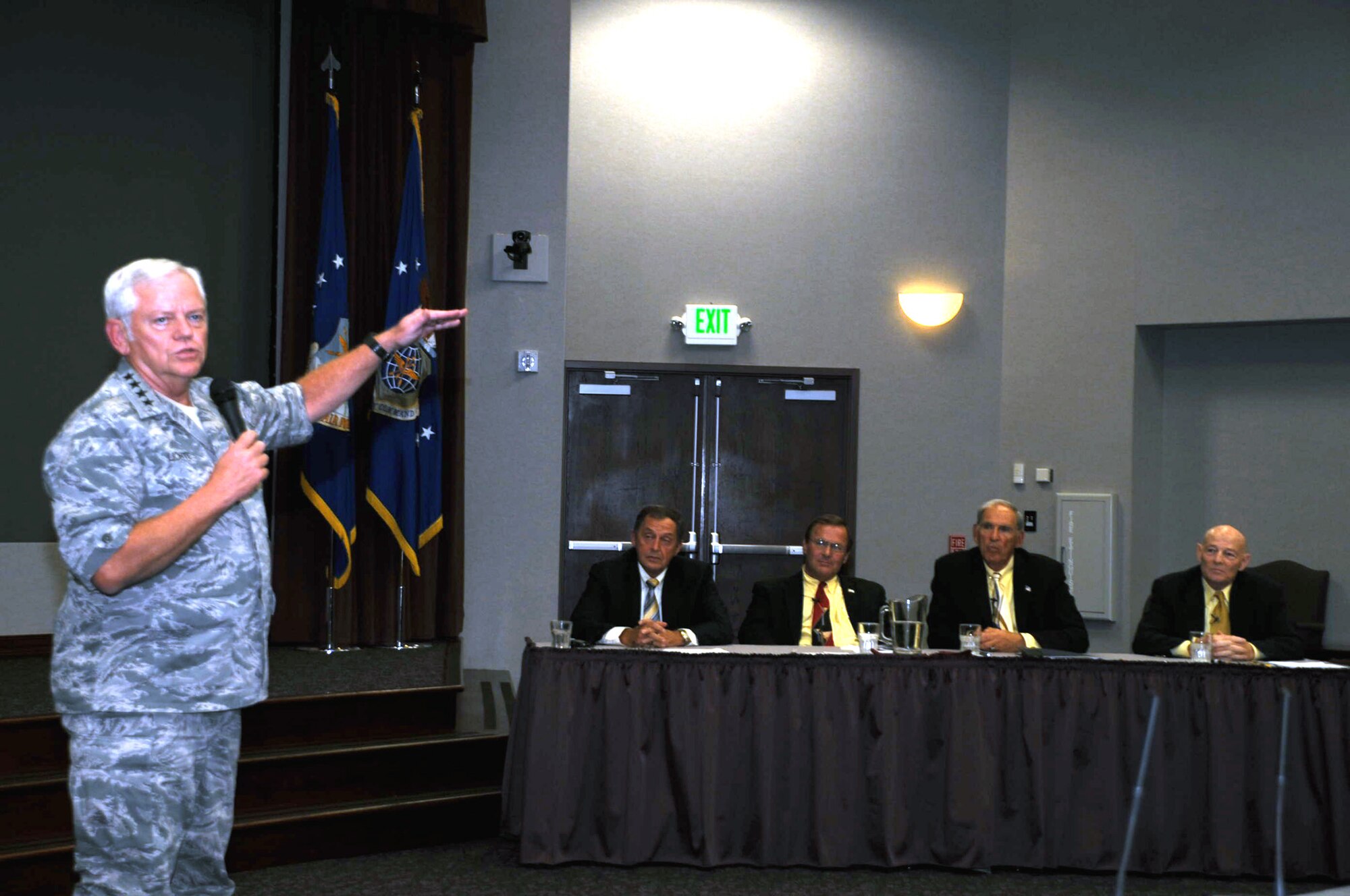 Gen. Arthur J. Lichte, Air Mobility Command commander, demonstrates how four retired Airmen "set the bar high" during their time in coordinating air refueling efforts in 1990-91's Operation Desert Shield and Desert Storm. The discussion was held during a session of AMC's Tanker Living Legends Speaker Series in the Global Reach Planning Center at Scott Air Force Base, Ill, on Aug. 28, 2009.  Among those participating in the panel, pictured here, are (from left) retired Col. Dennis D. Carpenter, retired Lt. Col. Scott Hente, retired Lt. Gen. Pat Caruana, and retired Brig. Gen. Kenneth F. Keller.  All four of the retired officers were on hand to recall their experiences for Operations Desert Shield and Desert Storm.  (U.S. Air Force Photo/Tech. Sgt. Scott T. Sturkol) 
