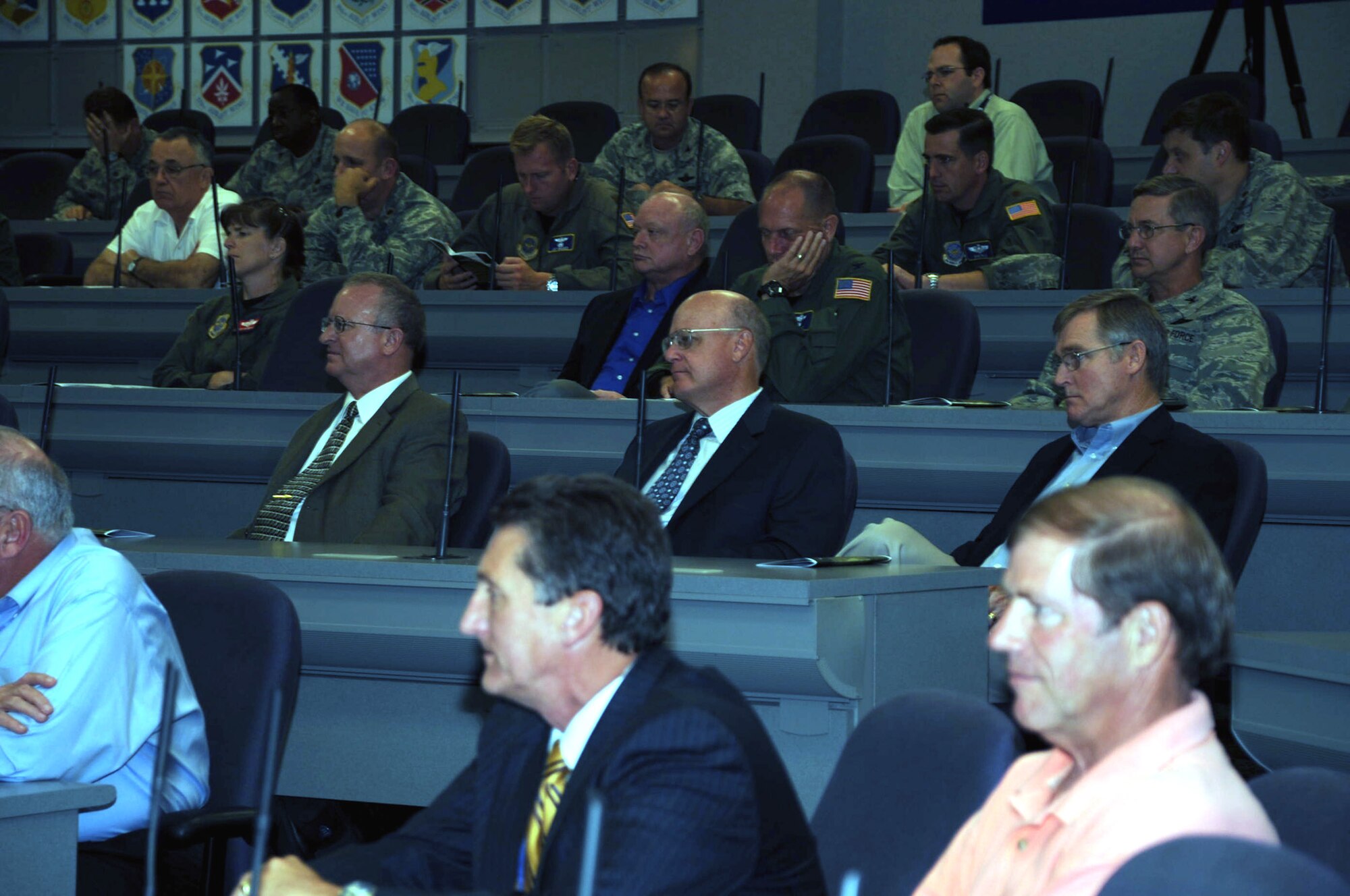 Audience members listen in to the Air Mobility Command held another session of its Tanker Living Legends Speaker Series in the Global Reach Planning Center at Scott Air Force Base, Ill, on Aug. 28, 2009.  Among those participating in the panel included retired Col. Dennis D. Carpenter, retired Lt. Col. Scott Hente, retired Lt. Gen. Pat Caruana, and retired Brig. Gen. Kenneth F. Keller.  All four of the retired officers were on hand to recall their experiences in coordinating air refueling efforts for Operations Desert Shield and Desert Storm in 1990-91.  (U.S. Air Force Photo/Tech. Sgt. Scott T. Sturkol) 