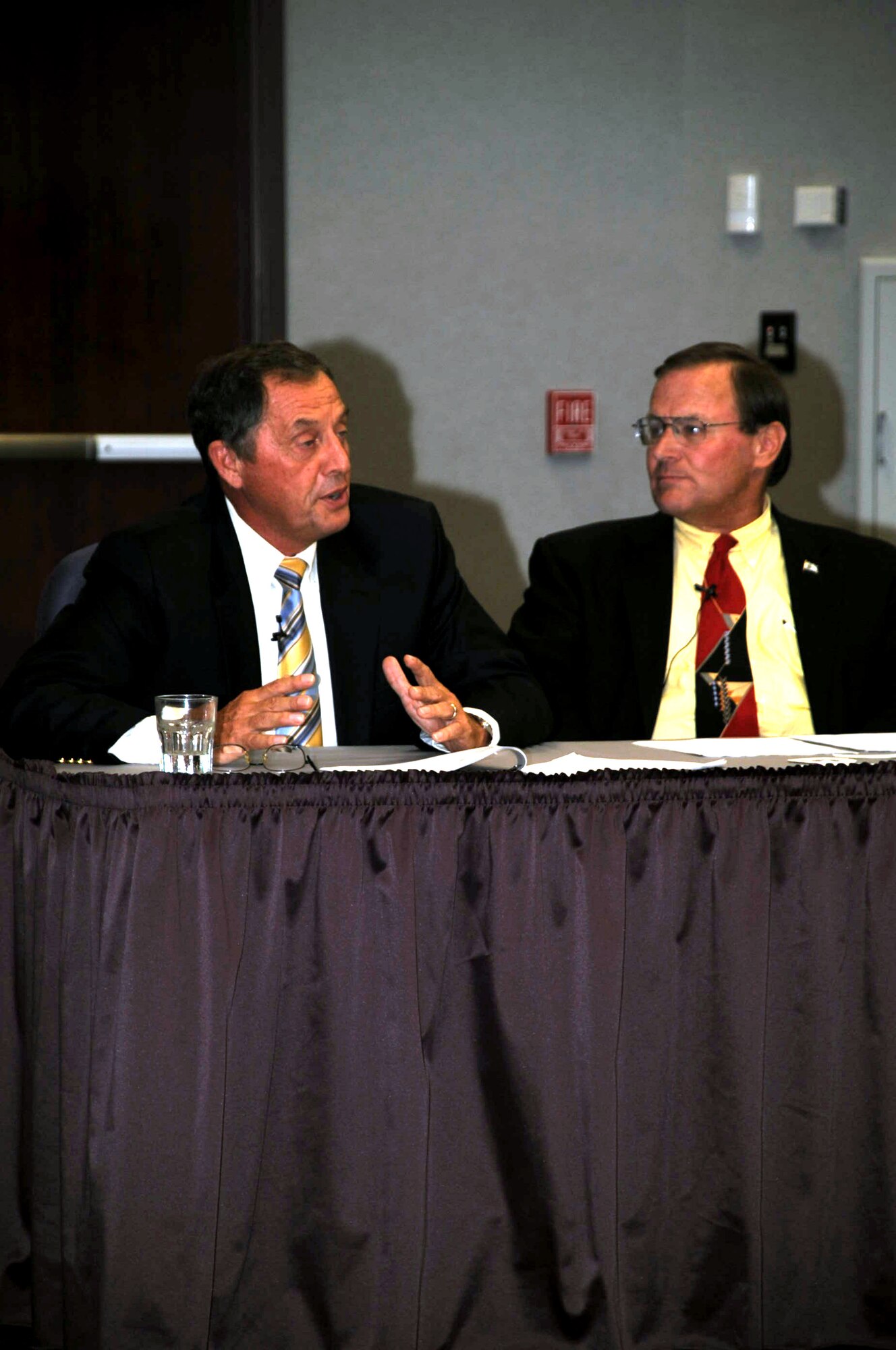 Retired Col. Dennis Carpenter (left) talks about his experience in coordinating air refueling for Operations Desert Shield and Desert Storm in 1990-91 as part of the Tanker Living Legends Speaker Series on Aug. 28, 2009, at the Global Reach Planning Center at Scott Air Force Base Ill..  Next to Colonel Carpenter is retired Lt. Col. Scott Hente. In total there were four panel members for the speaker series put on by Air Mobility Command. (U.S. Air Force Photo/Tech. Sgt. Scott T. Sturkol) 