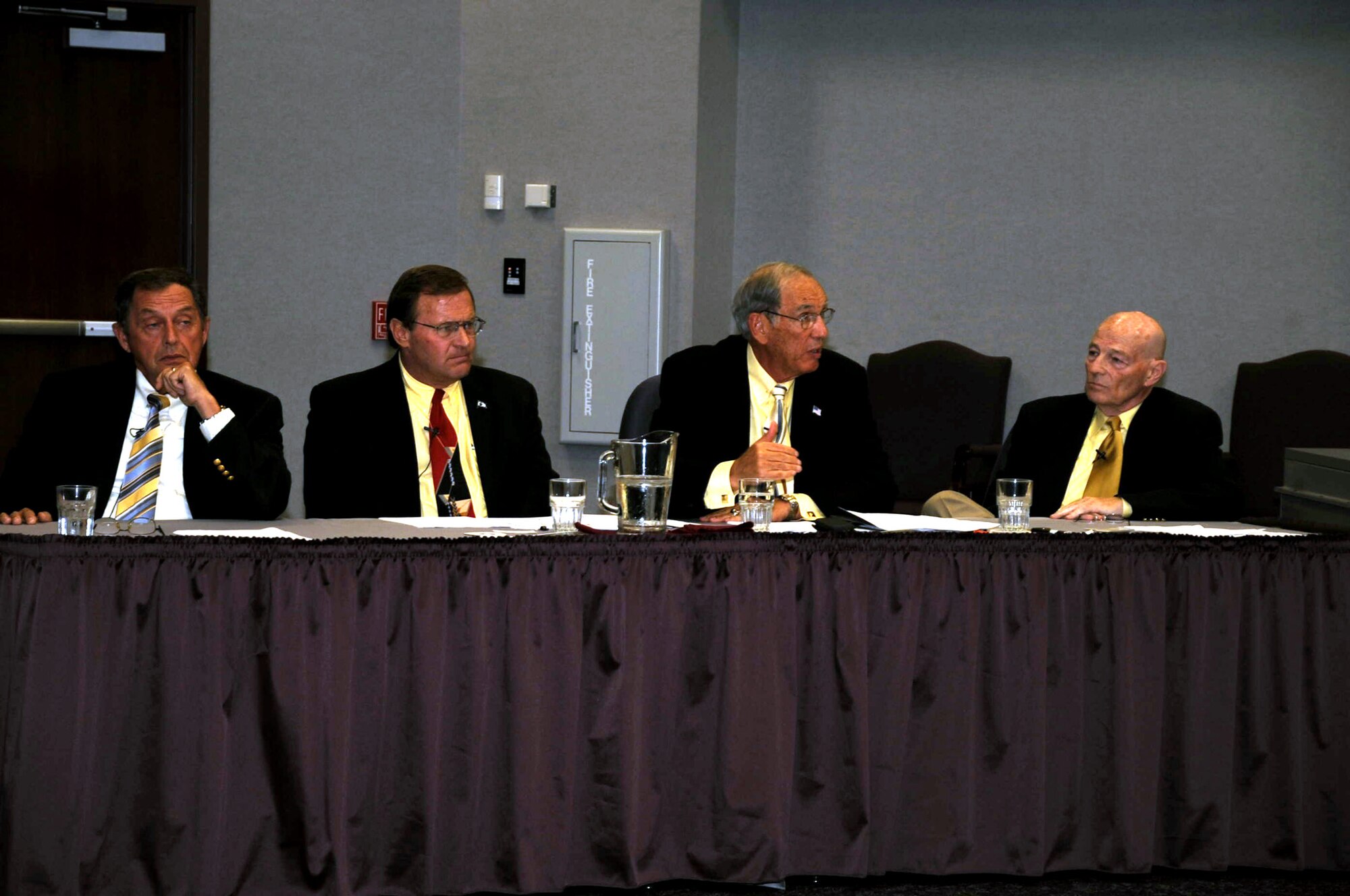 Retired Lt. Gen. Pat Caruana (second from right) talks about his experience in coordinating air refueling for Operations Desert Shield and Desert Storm in 1990-91 as part of the Tanker Living Legends Speaker Series on Aug. 28, 2009, at the Global Reach Planning Center at Scott Air Force Base Ill..  Sitting to the right is retired Brig. Gen. Kenneth Keller and to the left is retired Col. Dennis Carpenter and retired Lt. Col. Scott Hente.  All four were panel members for the speaker series put on by Air Mobility Command. (U.S. Air Force Photo/Tech. Sgt. Scott T. Sturkol) 