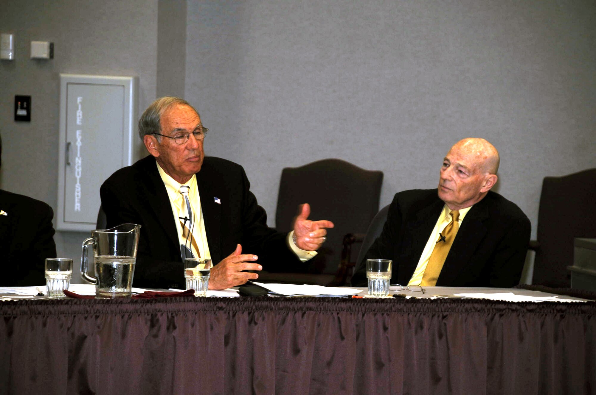 Retired Lt. Gen. Pat Caruana (left) talks about his experience in coordinating air refueling for Operations Desert Shield and Desert Storm in 1990-91 as part of the Tanker Living Legends Speaker Series on Aug. 28, 2009, at the Global Reach Planning Center at Scott Air Force Base Ill..  Sitting to the right is retired Brig. Gen. Kenneth Keller.  In total there were four panel members for the speaker series put on by Air Mobility Command. (U.S. Air Force Photo/Tech. Sgt. Scott T. Sturkol) 