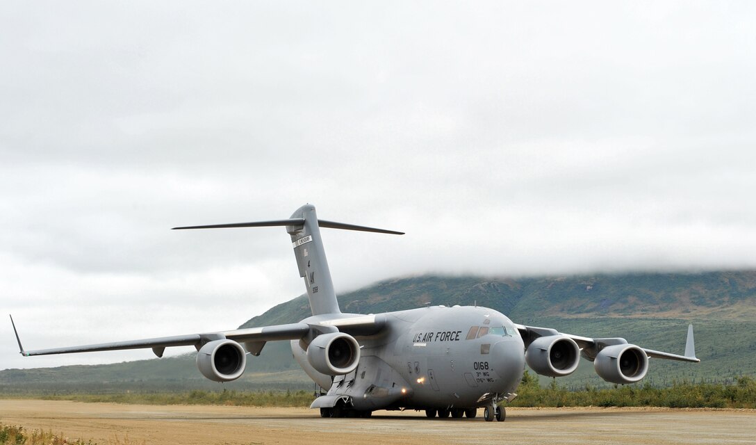 A C-17 Globemaster III from the 517th Airlift Squadron taxies down an dirt air strip Aug. 24 near Elmendorf Air Force Base, Alaska. The aircraft and its aircrews deployed 120 Soldiers from the 17th Combat Service Support Battalion on Fort Richardson, Alaska, to the airstrip during Operation Arctic Response. (U.S. Air Force photo/Senior Airman Laura Turner) 