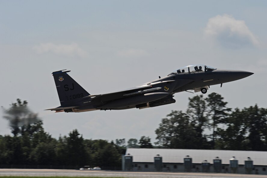 Maj. Lewis “Nordo” Collins, 334th Fighter Squadron pilot, takes off in an F-15E Strike Eagle with John Dibbs, a free-lance air-to-air photographer, in the back seat. Mr. Dibbs photographed the F-15Es in action for layouts in his large coffee table book, “Combat Edge,” and Air Forces Monthly magazine. (U.S. Air Force photo by Master Sgt. Brandt Smith)