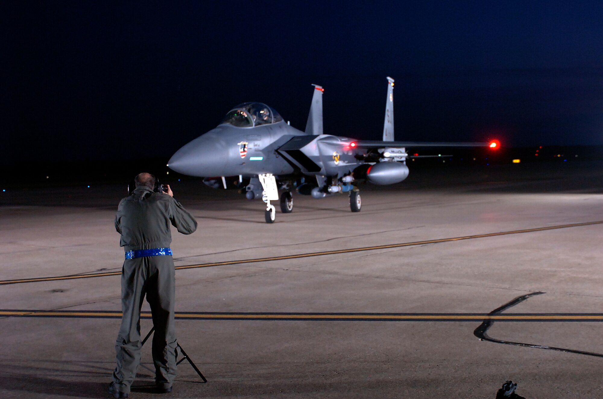 John Dibbs, a free-lance air-to-air photographer, captures images of an F-15E Strike Eagle at Seymour Johnson Air Force Base, N.C., Aug. 26, 2009. Mr. Dibbs has flown in approximately 120 aircraft to document more than 900 different planes.  (U.S. Air Force photo by Master Sgt. Brandt Smith)