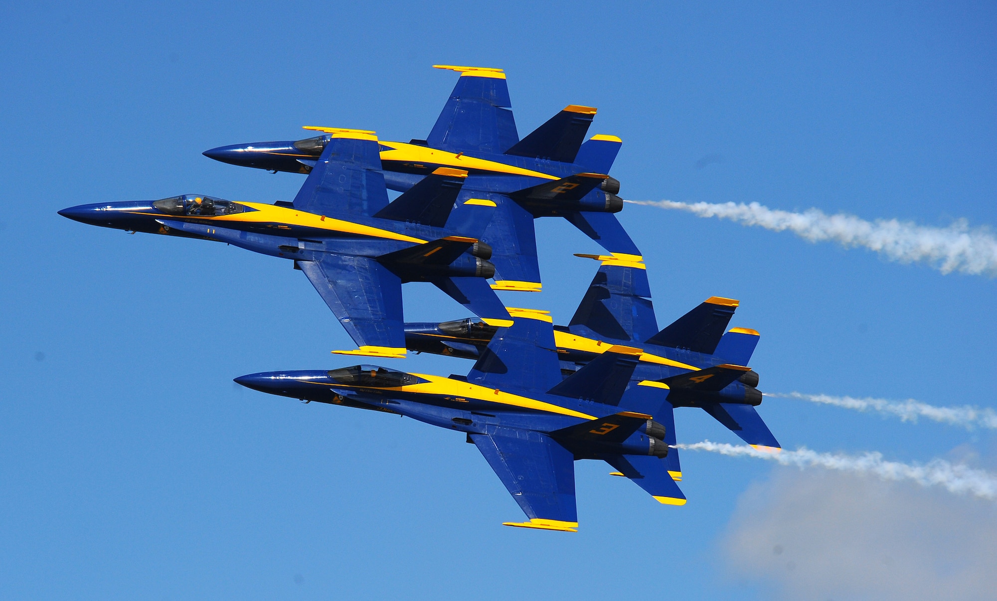 OFFUTT AIR FORCE BASE Neb. -- The U.S. Navy's Blue Angels, an F-18 demonstration team, perform breathtaking stunts in their famous diamond formation during the 2009 Defenders of Freedom Open House and Air Show here Aug. 29 - 30. U.S. Air Force Photo by Josh Plueger
