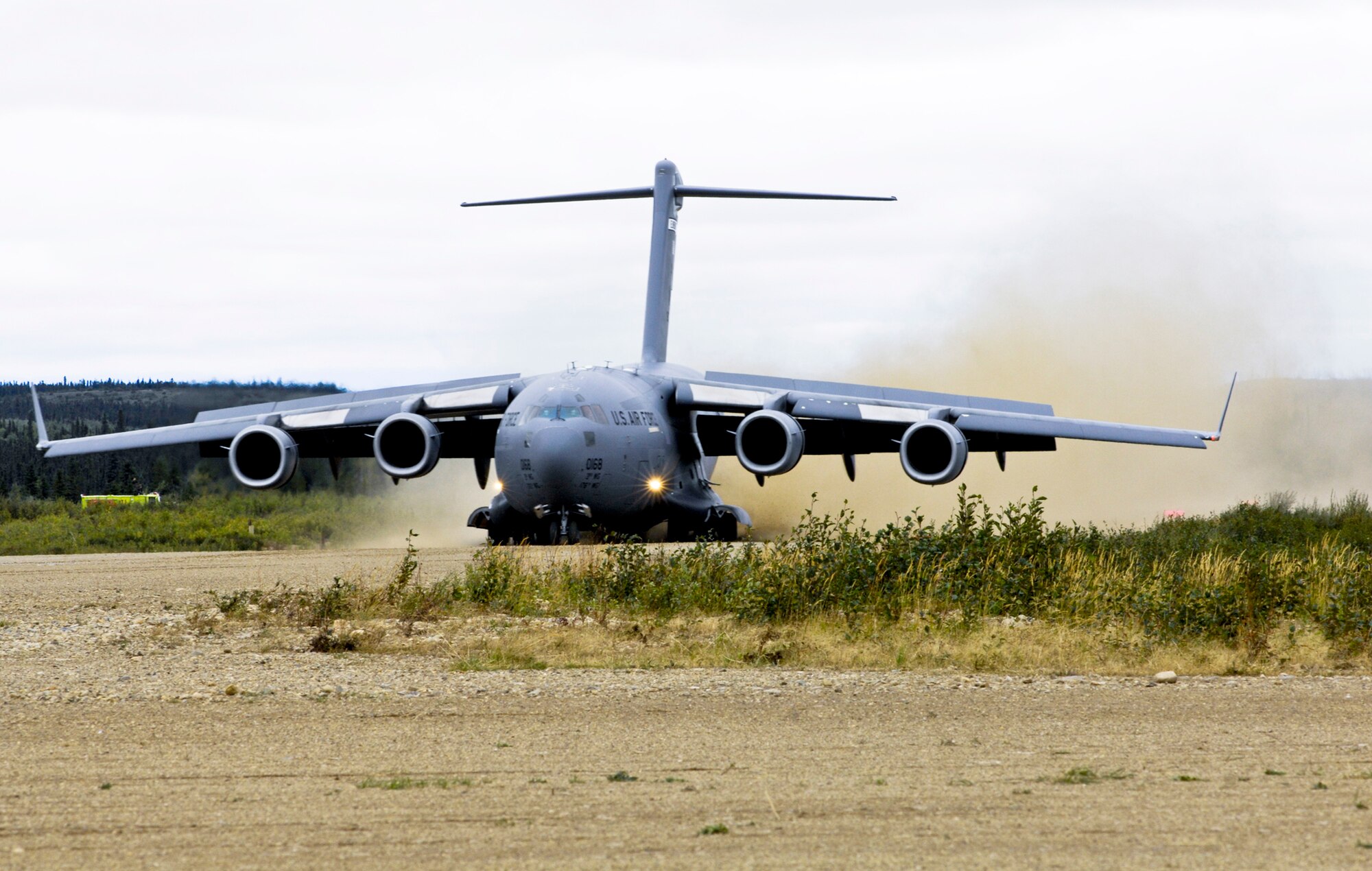 A C-17 Globemaster III executes a semiprepared runway operation landing Aug. 24 at an unimproved landing strip near Elmendorf Air Force Base, Alaska. Airmen from the 517th Airlift Squadron and 249th Airlift Squadron participated in the Army's Operation Arctic Response to help deploy 120 Soldiers and supplies to the remote site. (U.S. Air Force photo/Airman 1st Class Christopher Gross) 