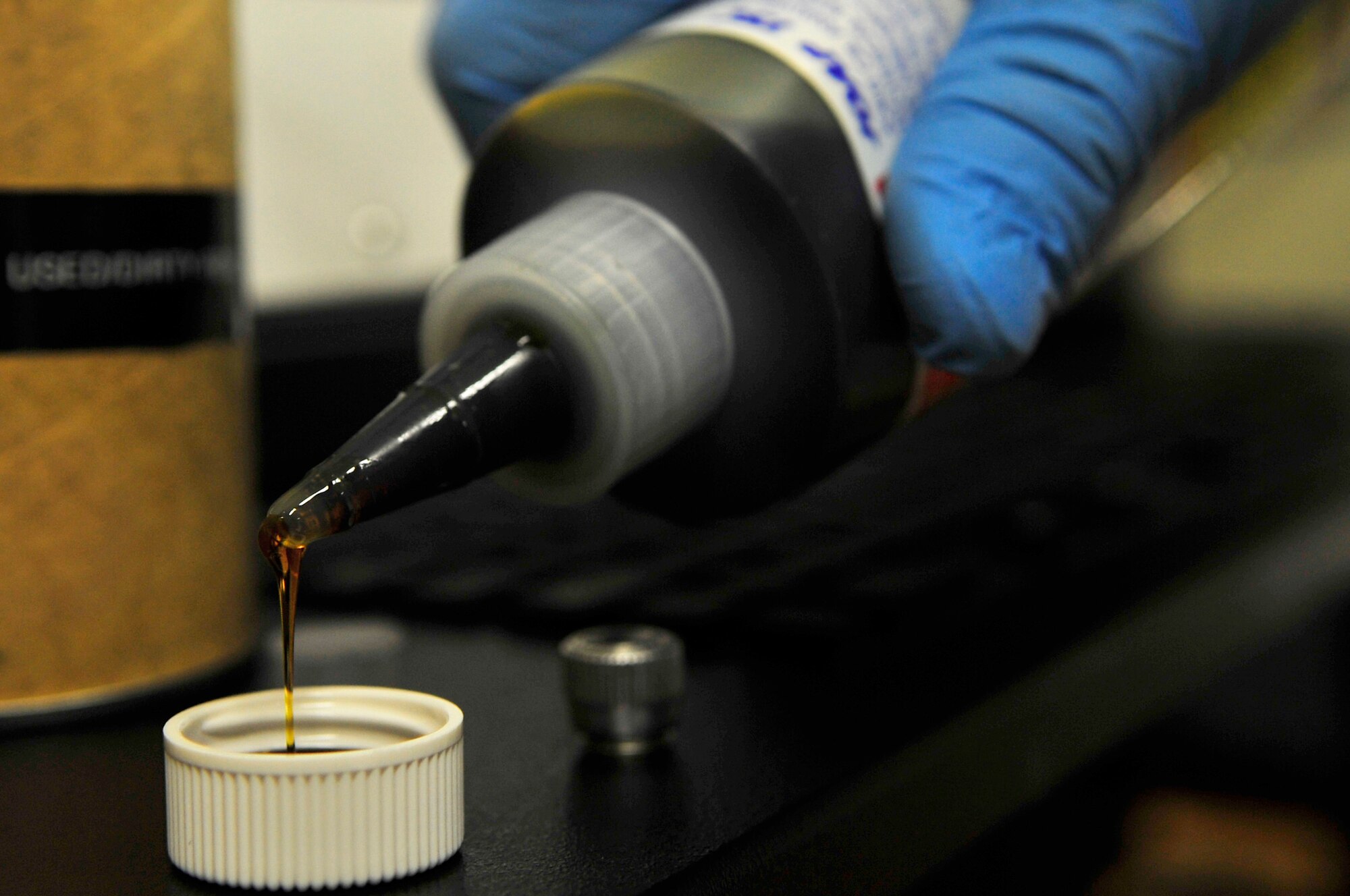 Airman 1st Class Marvin Moss prepares an oil sample Aug. 26, 2009, Eielson Air Force Base. After each flight, an oil sample is brought to the non-destructive inspection section for analysis, ensuring the elements in the oil are good. Airman Moss is a NDI journeyman assigned to the 354th Maintenance Squadron. (U.S. Air Force photo/Staff Sgt. Christopher Boitz)