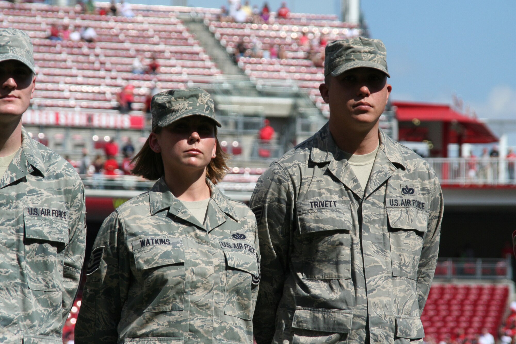 CINCINNATI, Ohio - Tech. Sgt. Tiffany Watkins and Staff Sgt. Scott Trivett, both of the 445th Civil Engineer Squadron, stand on the field at the Great American Ball Park, home of the Cincinnati Reds, waiting for their names to be announced during the pregame ceremony.  The 445th Airlift Wing reservists were recognized, Aug. 29, 2009, for recently returning from a deployment .  The Saturday game was Cincinnati Reds Military Appreciation Day. (Air Force photo/Staff Sgt. Amanda Duncan)  