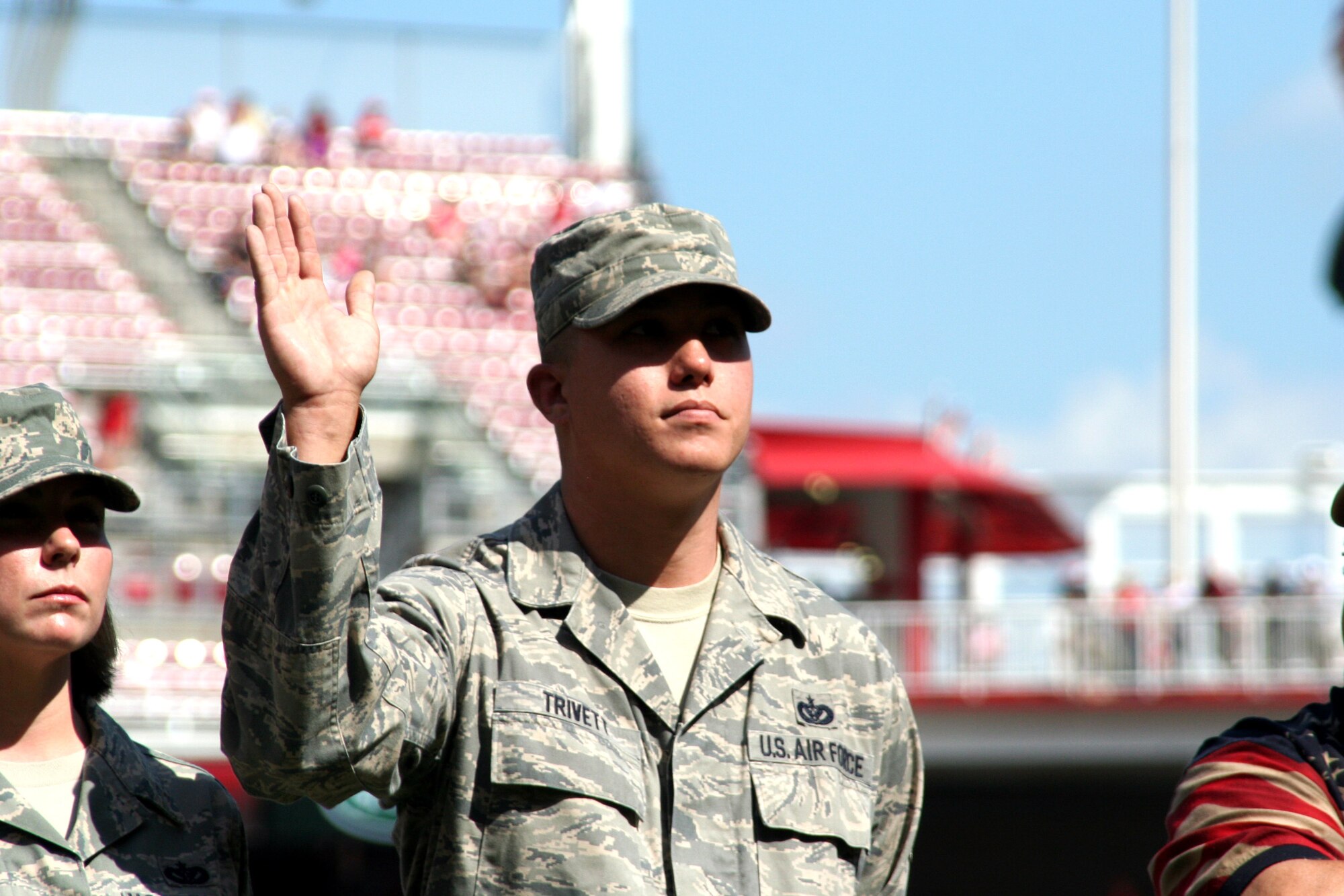 CINCINNATI, Ohio - Staff Sgt. Scott Trivett, 445th Civil Engineer Squadron, waves as his name is announced while on the field at the Cincinnati Reds' Great American Ball Park.  Sergeant Trivett was recognized during the pregame ceremony, Aug. 29, 2009, for recently returning from a deployment .  The Saturday game was Cincinnati Reds Military Appreciation Day. (Air Force photo/Staff Sgt. Amanda Duncan)  