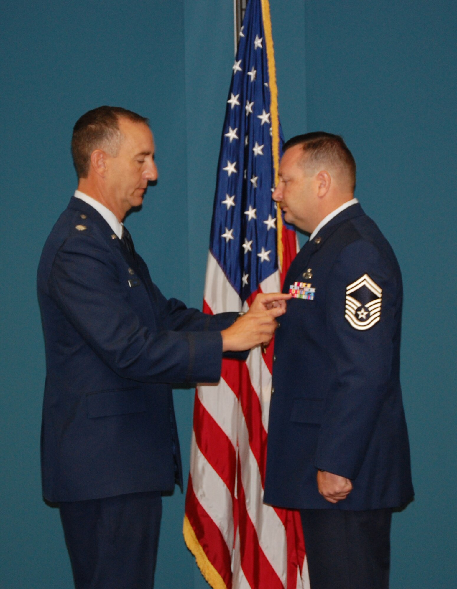 SEYMOUR JOHNSON AIR FORCE BASE, N.C. -- Senior Master Sgt. Dominick Tallarida receives the bronze star for his work as combat advisor maintenance superintendant while deployed to Iraq in 2008 and 2009. Pinning the bronze star is his commander, Lt. Col. Wiliiam Uptmor. Both are members of the 911th Air Refueling Squadron.