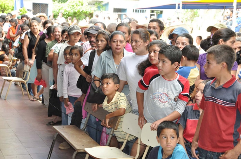SAN FERNANDO, El Salvador — A crowd gathers and waits to receive free medical care during a medical readiness and training exercise, or MEDRETE, here Aug. 26. Residents of the San Fernando area walked hours to the medical exercise, where many of them saw doctors for the first time in decades. A team of personnel from Joint Task Force-Bravo, the Salvadoran military and the Salvadoran Ministry of Health worked together during the two-day medical exercise to provide free medical care to more than 900 patients (U.S. Air Force photo/1st Lt. Jennifer Richard).