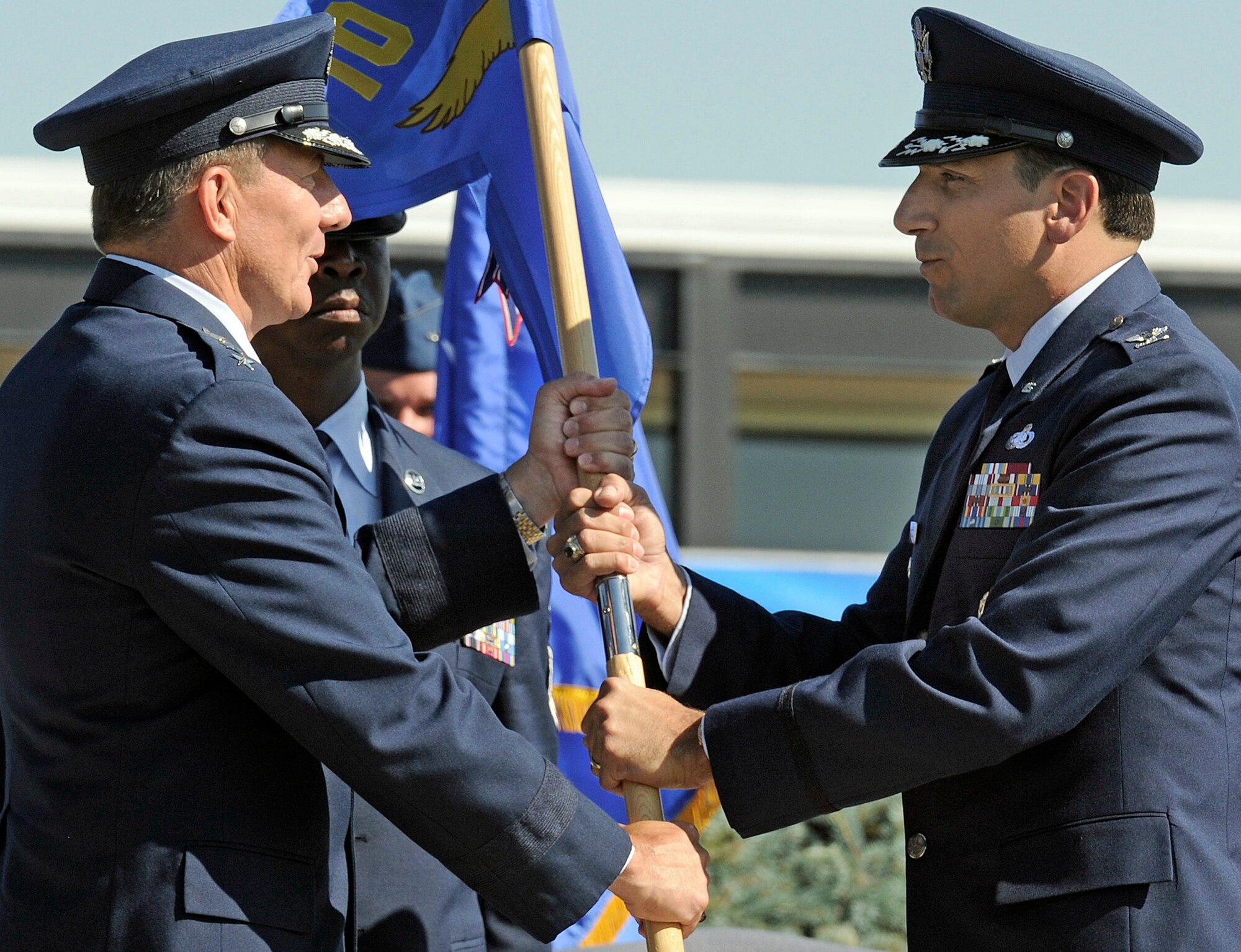 Col. Rick LoCastro, right, accepts the 10th Air Base Wing guidon from Lt. Gen. Mike Gould during the 10th ABW change-of-command ceremony at the U.S. Air Force Academy July 23, 2009. Colonel LoCastro was previously vice commander of the 96th ABW at Eglin Air Force Base, Fla. General Gould is the Academy superintendent. (U.S. Air Force photo/Mike Kaplan)