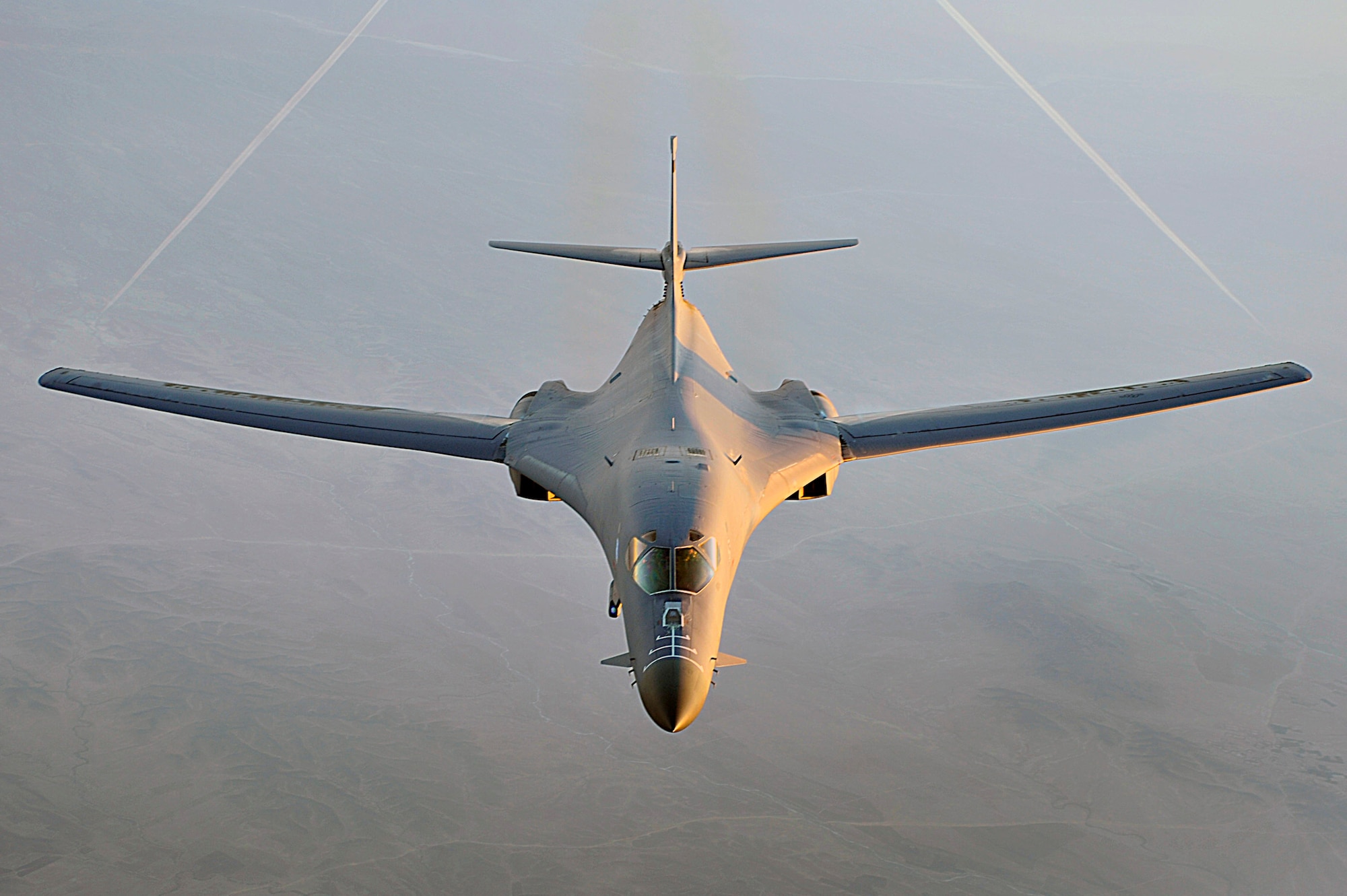 A B-1B Lancer flies a combat patrol over Afghanistan in support of Operation Enduring Freedom. The B-1B has the capability to carry guided and unguided weapons and deliver massive quantities of precision and non-precision weapons against specific targets. (U.S. Air Force photo/Staff Sgt. Aaron Allmon) 