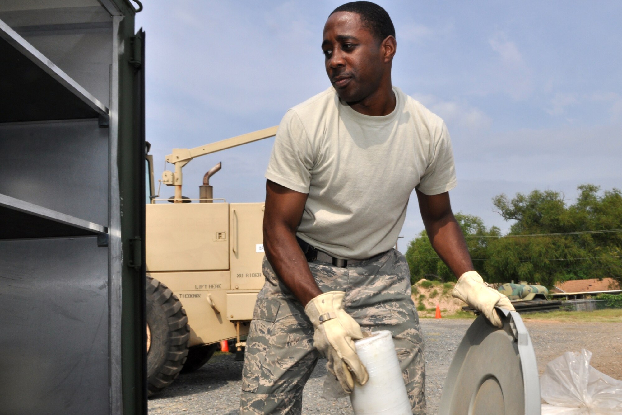 Staff Sgt. Frank Jackson, knowledge operations manager, 917th Civil Engineer Squadron, loads a conex container with spare parts and equipment for storage at the CE warehouse located behind the 917th Wing Headquarters building at Barksdale Air Force Base, La., August 27, 2009. Room is being made for contractors who will construct training classrooms, a storage area and a bathroom inside the warehouse. The Global Strike Command is paying for the renovation since they will soon occupy the office space the 917th CES recently vacated.  Construction is schedule for two weeks and should be completed by the September UTA. (U.S. Air Force photo/Tech. Sgt. Jeff Walston)