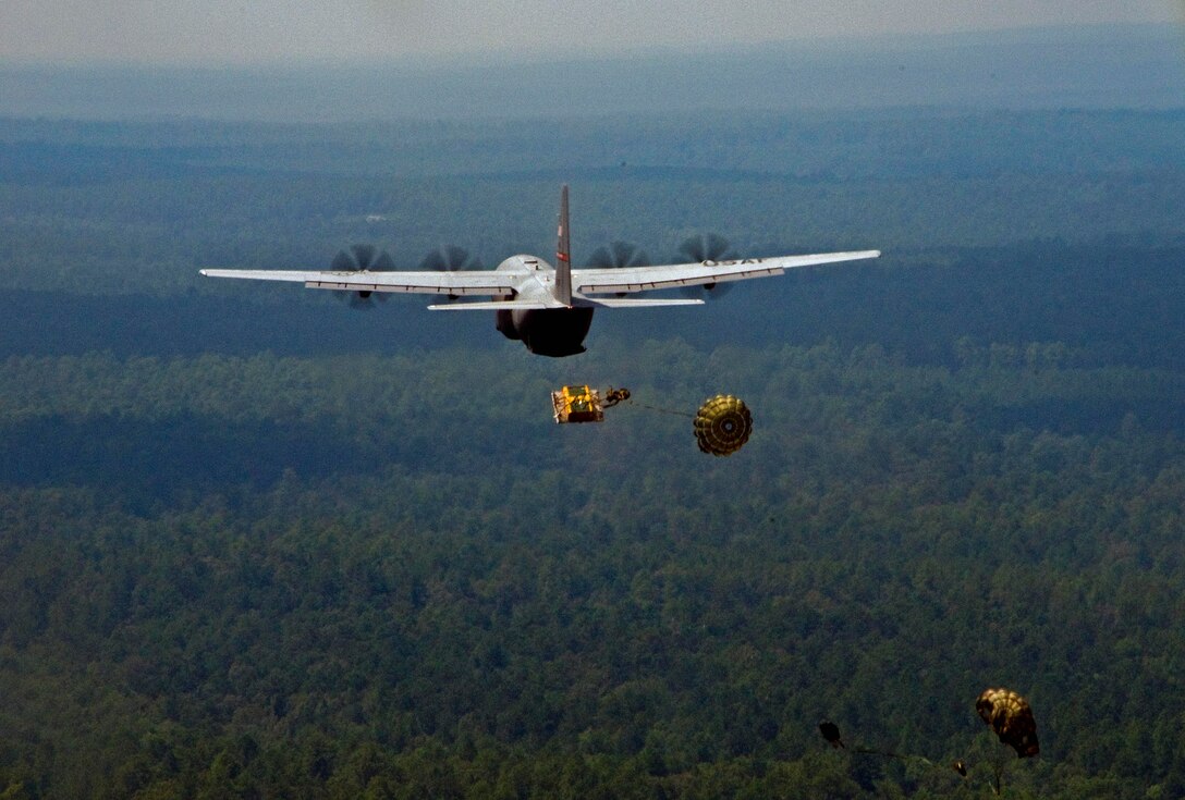 Reservists from the 815th Airlift Squadron "Flying Jennies" train in August for their upcoming deployment to Southwest Asia in early September.  Part of their training includes using a new cargo delivery system, which enables them to drop cargo pallets more accurately.  (U.S. Air Force Photo by Staff. Sgt. Tanya King)