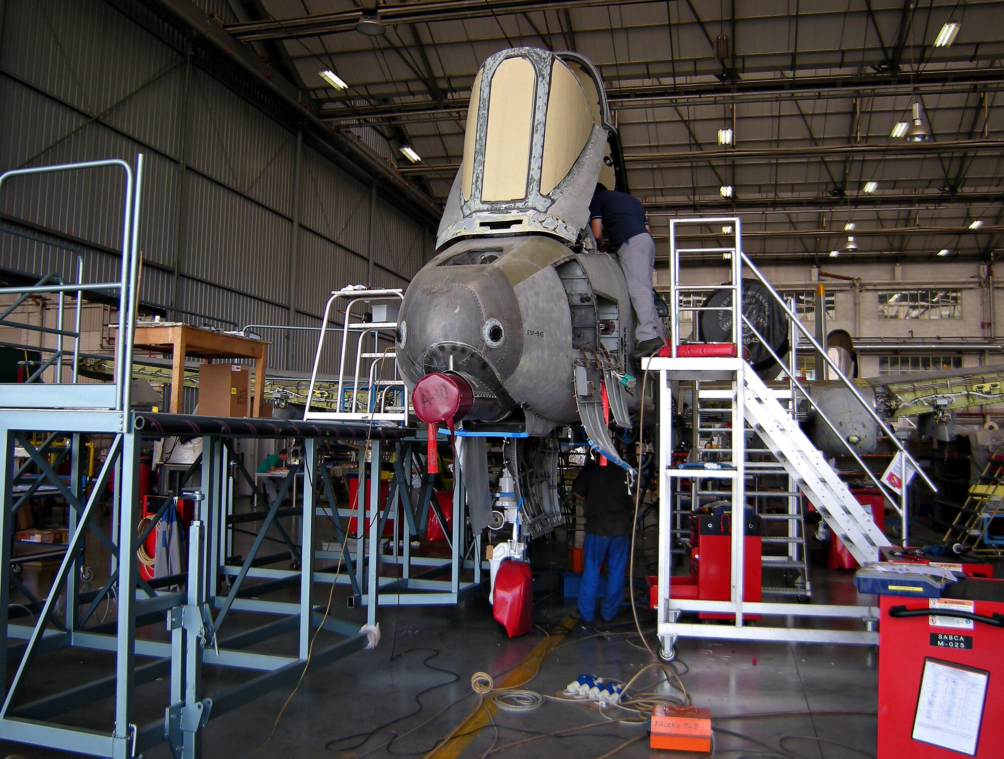 SPANGDAHLEM AIR BASE, Germany -- A gutted A-10 Thunderbolt II is converted from the A to C model Aug. 27 at S.A.B.C.A. The entire 81st Fighter Squadron fleet is undergoing the conversion, which enables the pilot to deliver precision-guided munitions, enhances digital communications with more air and ground forces, and moves several switches to the throttle and stick so that the pilot limits heads down time enabling him/her to focus outside of the cockpit directly into the battlespace. (U.S. Air Force photo by/2nd Lt. Kathleen Polesnak)

