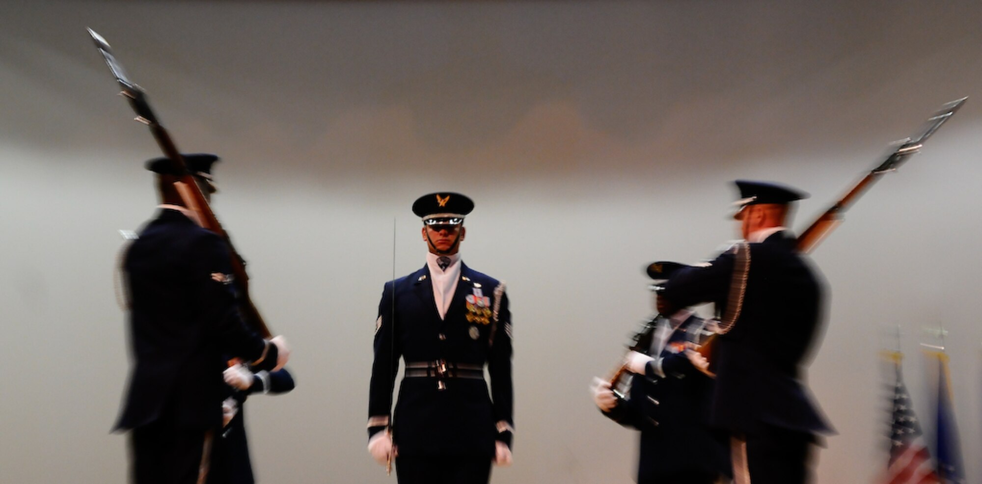 The United States Air Force Honor Guard Drill Team four-man component performs at a commander’s call for the 45th Space Wing Aug. 28 at Patrick Air Force Base, Fla. The four-man team left directly after the performance to join the rest of the team at Eau Gallie High School for the second of their three performances. During the Florida tour, the Drill Team will be performing at military installations and local schools and communities to help raise awareness of the Air Force mission. (U.S. Air Force photo by Senior Airman Alexandre Montes)  