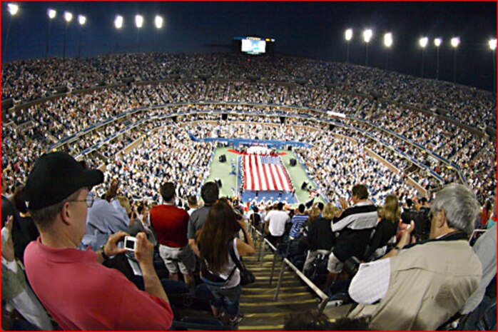 Marines from 6th Communications Battalion, 4th Marine Logistics Group, unfurl an American Flag across the tennis court during the opening ceremony for the U.S. Open at USTA Billie Jean King National Tennis Center, New York City. This is the 127th year of the annual tennis tournament. (Official Marine Corps photo by New York City Public Affairs Office)