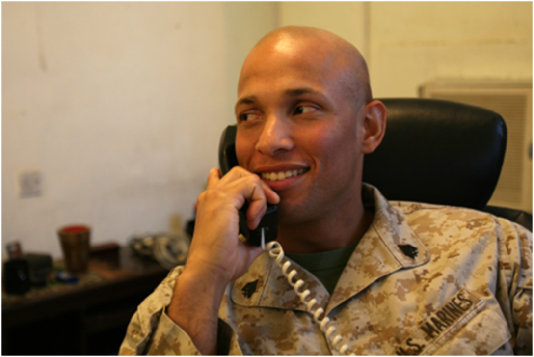091126-M-8077B-013:  Sgt. Miguel A. Jimenez, the Personal Security Detachment noncommissioned officer-in-charge, Combat Logistics Regiment 27 (Forward), is on hold for the President of the United States.  Jimenez received a phone call from President Barack Obama in honor of the Thanksgiving holiday. (U.S. Marine Corps photograph by Cpl. M. M. Bravo)