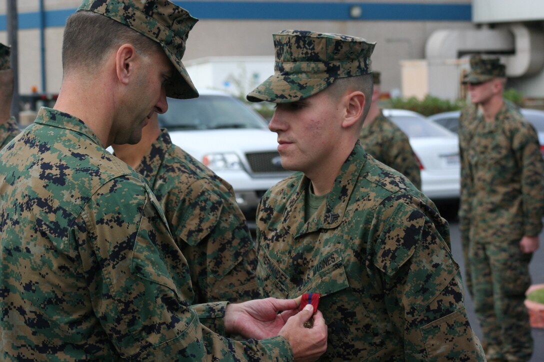 Corporal Daniel A. Hernandez receives his first Good Conduct Medal.