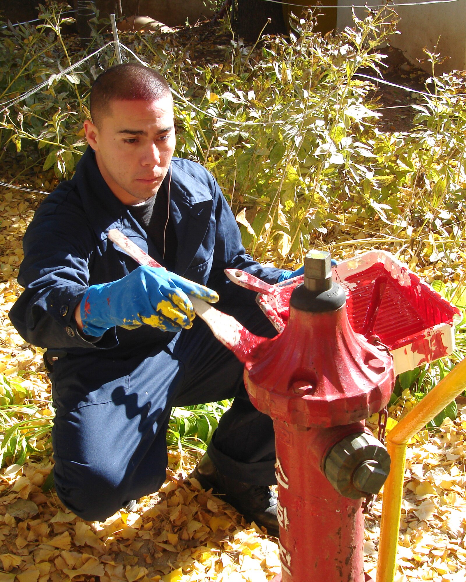 KUNSAN AIR BASE, Republic of Korea -- Airman 1st Class Jacob Banuelos, 8th Civil Engineer Squadron, paints a fire hydrant at the Ilmagwon Orphanage Nov. 21. Sixteen Airmen made a difference by donating their time to paint the Ilmagwon Orphanage and playground equipment, to maintain friendly relations with South Korean Civilization. (U.S. Air Force photo/Chaplain (Maj) Hector Colon)                               