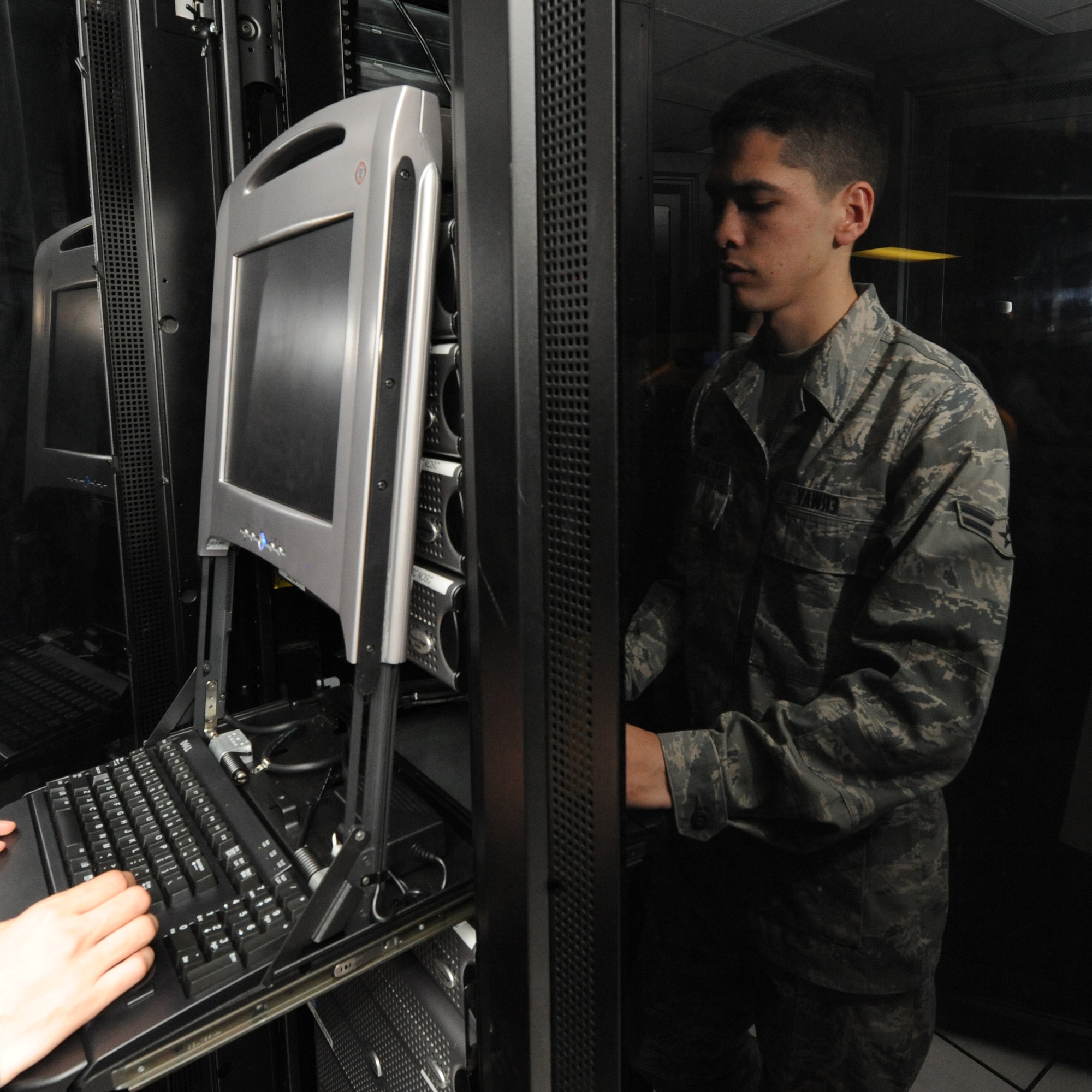 WHITEMAN AIR FORCE BASE, Mo., - Airman First Class Scott Erway, 509th Communication Squadron, runs a system check on a network server to find which system component had failed, Dec. 1. The communication focal point provides customers on base a one-stop shop, servicing phone and network servers, base-wide.  (U.S. Air Force Photo/Airman 1st Class Carlin Leslie)(released)