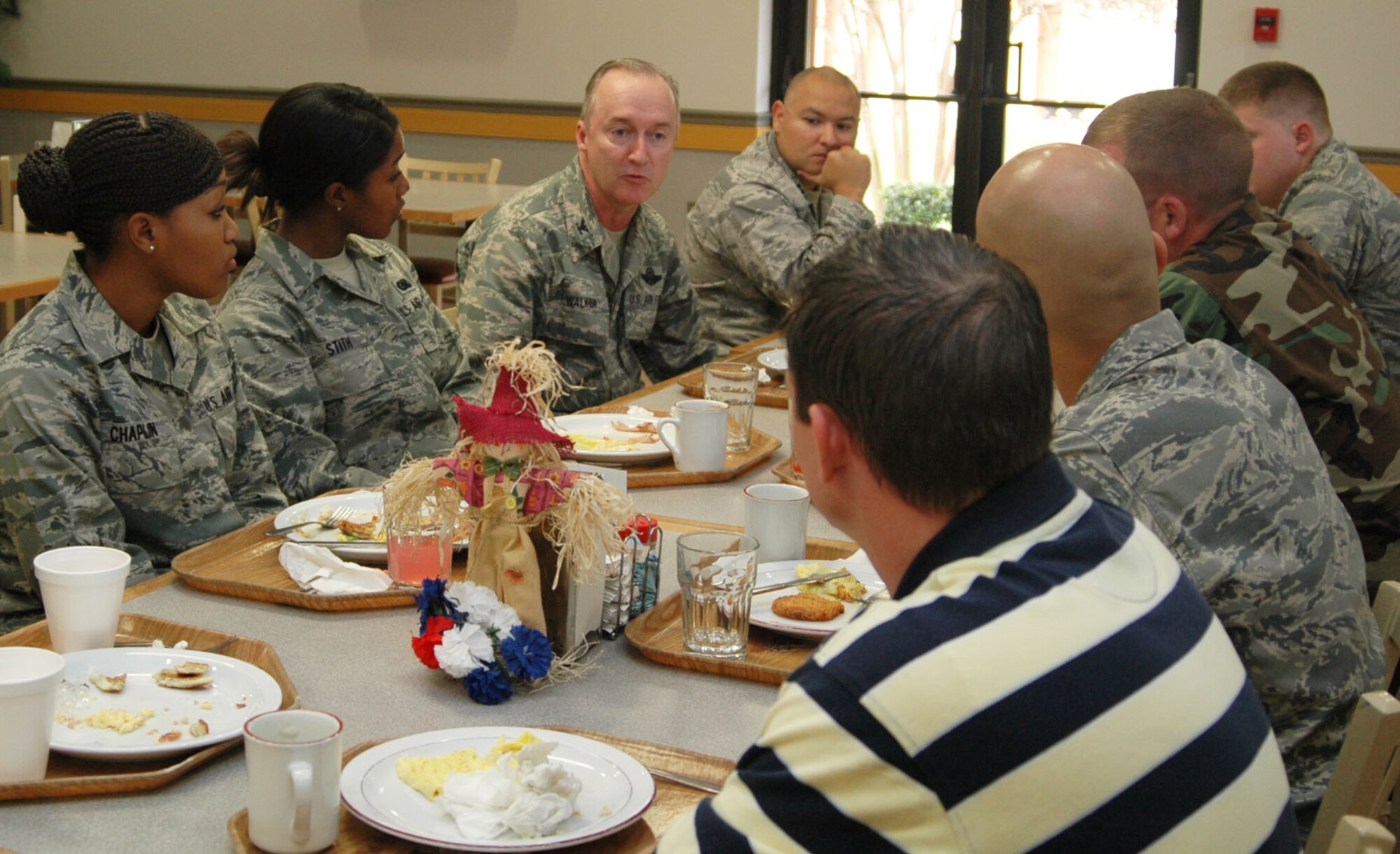 Col. Edmund Walker, commander of the 917th Wing at Barksdale Air Force Base, La., chats with in-coming Airmen to the unit during a welcome breakfast at the Red River Dining Inn, the dining facility on Barksdale November 8, 2009. The group of Airmen took part in the new event designed to give them the opportunity to talk with the 917th Commander about topics ranging from the mission and growth of the 917th WG to recreational activities available in the area. (U.S. Air Force photo/Senior Airman Crystal Jordan)