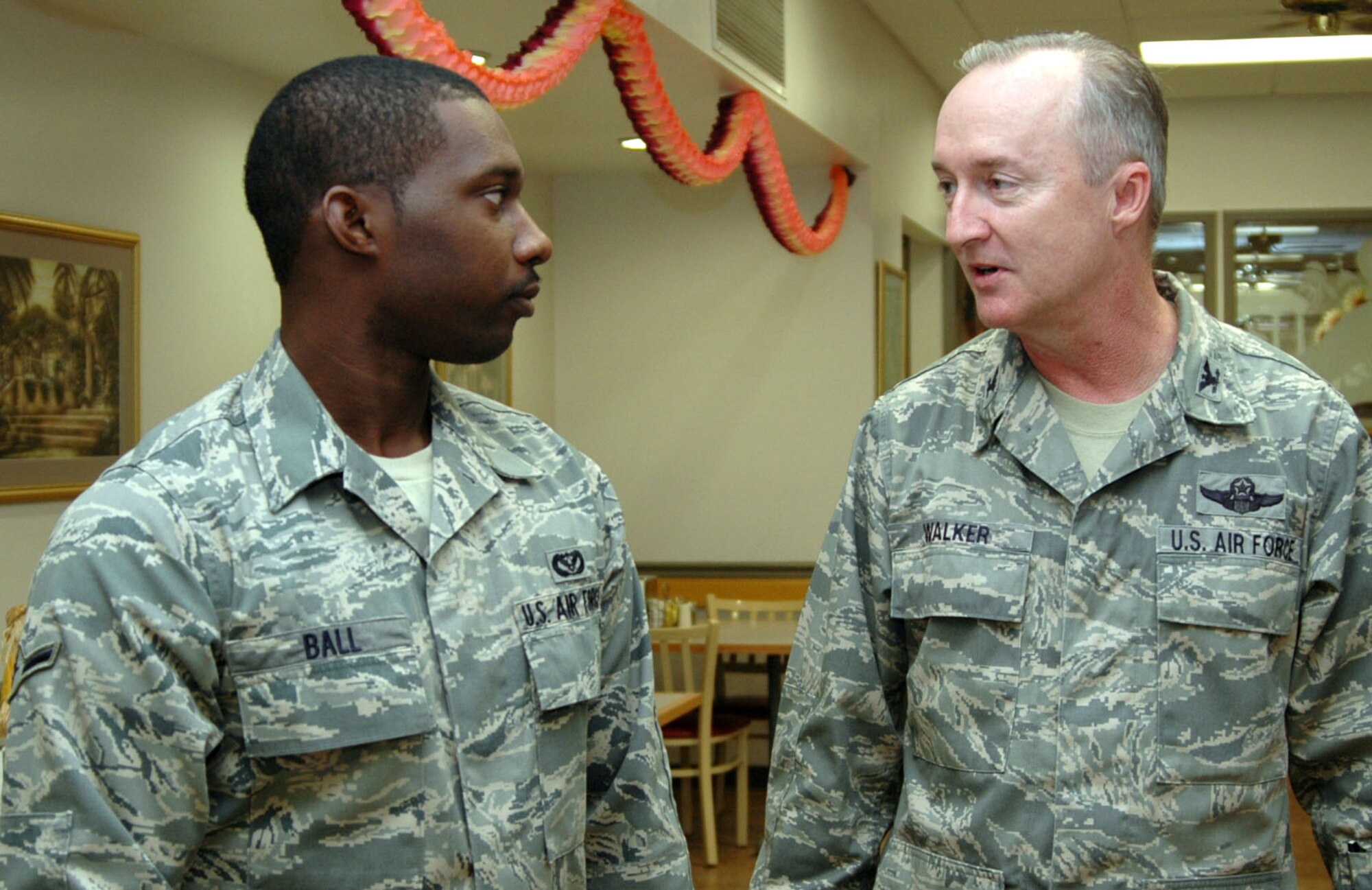 Col. Edmund Walker, commander of the 917th Wing, Barksdale Air Force Base, La, welcomes a new Airman to the unit November 8, 2009, during a welcome breakfast at the Red River Dining Inn, the dining facility on Barksdale. Airman Ricky Ball, a heating, ventilation and air conditioning technician for the 307th Red Horse Squadron, took part in the breakfast designed to give new Airmen the opportunity to ask senior staff members questions about the history, mission and future of the 917th WG. (U.S. Air Force photo/Senior Airman Crystal Jordan)