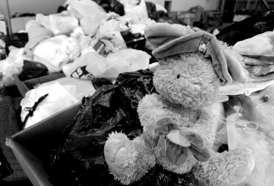 ANDERSEN AIR FORCE BASE, Guam - Toys, clothing, first aid kits and food are just a few items being boxed during the  Operation Christmas Drop pack here Nov. 21. More than 20 volunteers from DZSP-21 donated their time to pack more than 25 boxes. Operation Christmas Drop is a non-profit organization powered by volunteers from Andersen Air Force Base and the local Guam community. Each year, the two join forces to aid over 30,000 islanders in Chuuk, Palau, Yap, Marshall Islands and Commonwealth of the Northern Mariana Islands. (U.S. Air Force photo by Airman 1st Class Courtney Witt)
 