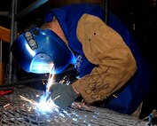 MINOT AIR FORCE BASE, N.D. -- Tech. Sgt. Terrance Carpenter, 5th Maintenance Squadron assistant noncommissioned officer-in-charge metals technician, repairs cracks on a B4 stand here Dec. 1. Repairs to aerospace ground equipment such as this provide safe and reliable equipment for all maintenance Airmen. (U.S. Air Force photo by Senior Airman Michael Veloz)