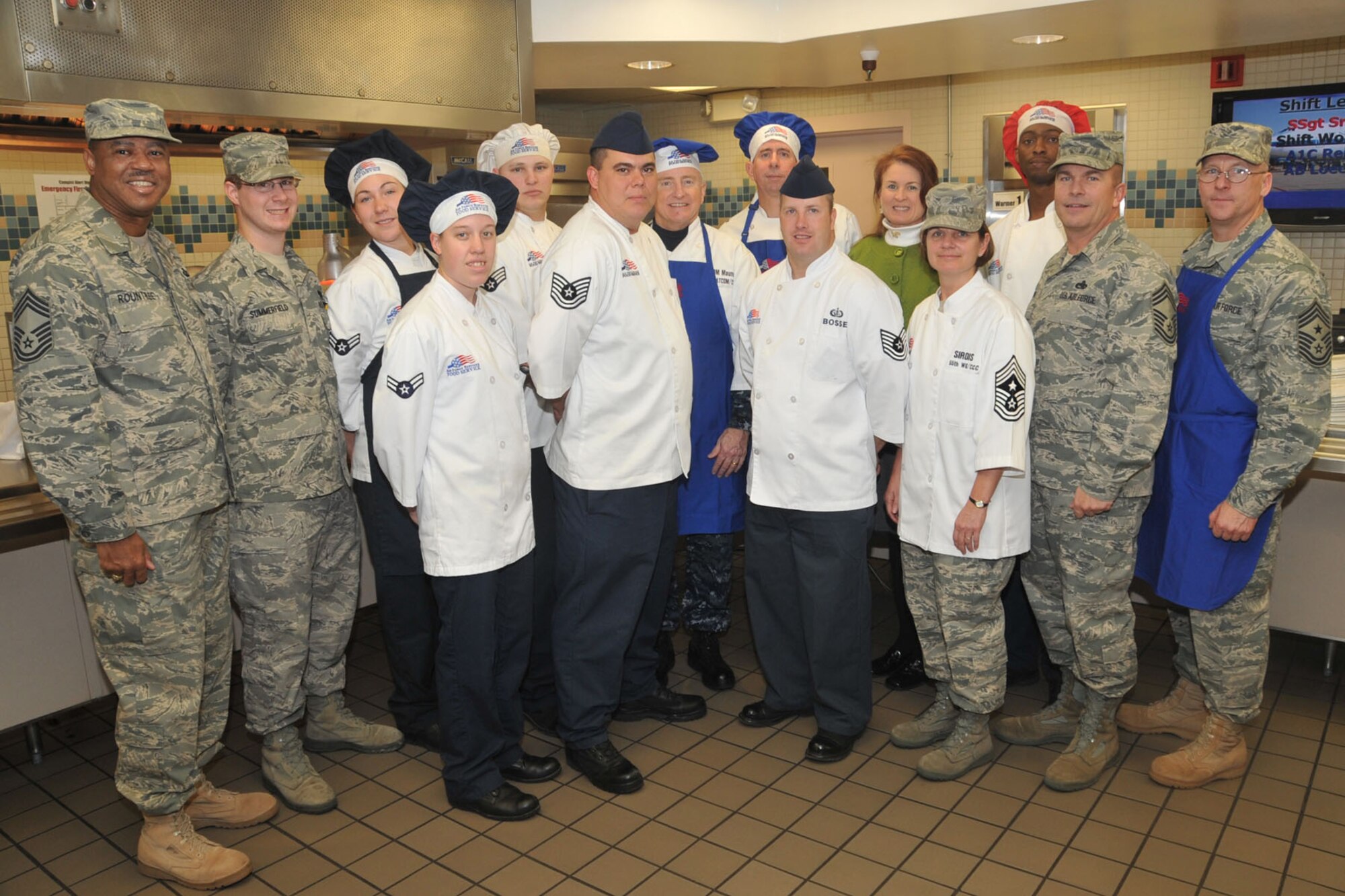OFFUTT AIR FORCE BASE, Neb. - Campisi Alert Dining Facility staff members pose for a photo with senior 55th Wing and U.S. Strategic Command leaders Nov. 26 at the Capisi Alert Dining Facility. U.S. Air Force Photo by Stephen Cunningham