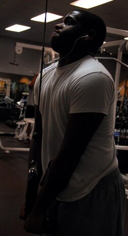 Airman 1st Class Jeromy Hamilton performs tricep extensions at the Fitness and Sports Center here Nov. 30. Airman Hamilton enjoyed Thanksgiving with a sister in Atlanta and made sure to visit the gym after the holiday break to work off the extra calories from smoked Thanksgiving turkey he ate. Airman Hamilton is a crew chief with the 437th Maintenance Squadron. (U.S. Air Force photo/Staff Sgt. Daniel Bowles)