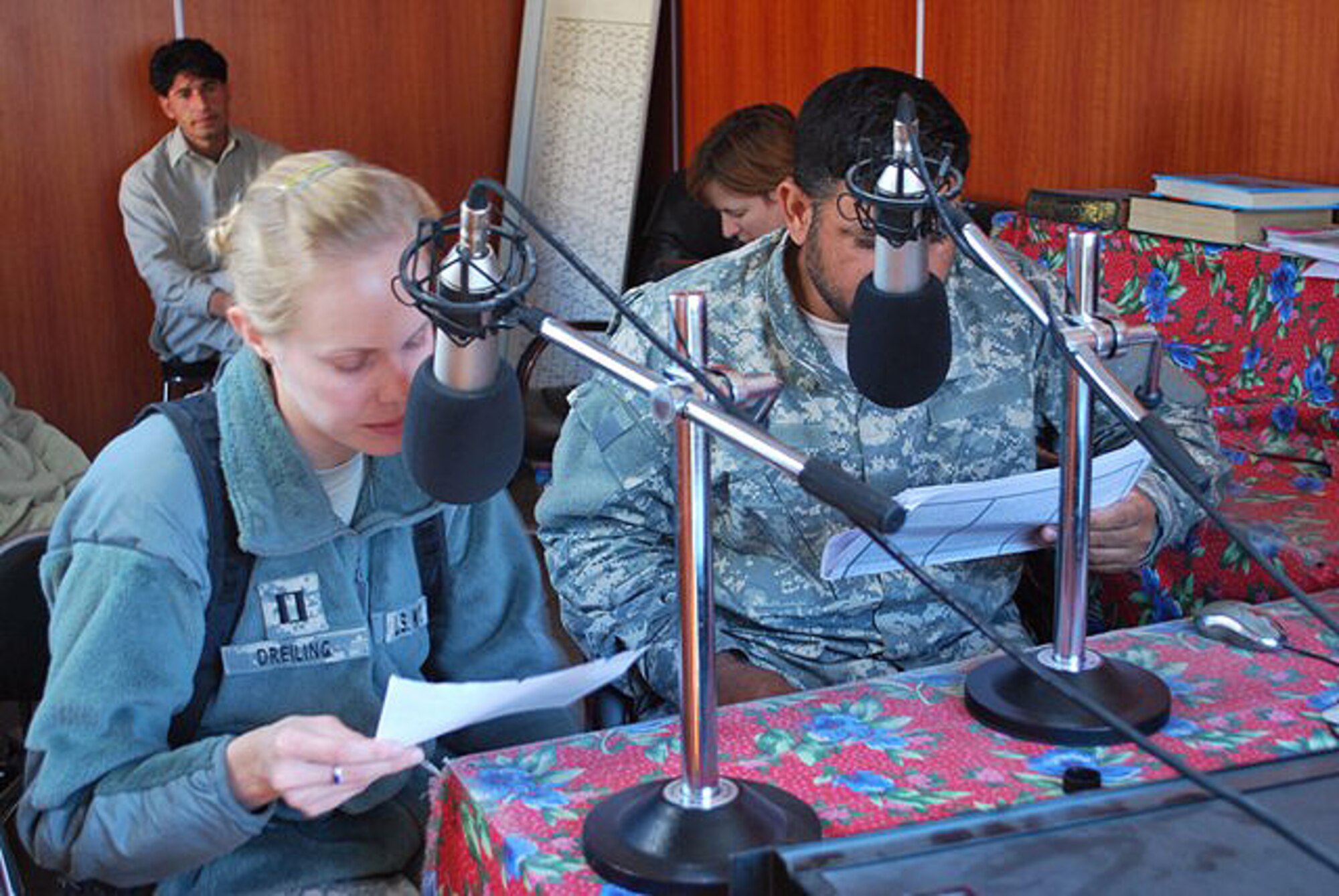 Navy Lt. Jennifer Dreiling, a senior medical officer for the Nuristan Provincial Reconstruction Team, records a radio message Nov. 19, 2009, on Radio Kalagush, a U.S.-funded Afghan radio station that broadcasts from Forward Operating Base Kalagush in eastern Afghanistan's Nuristan province, educating locals about the H1N1 flu virus.  (U.S. Air Force photo/2nd Lt. Natassia Cherne)