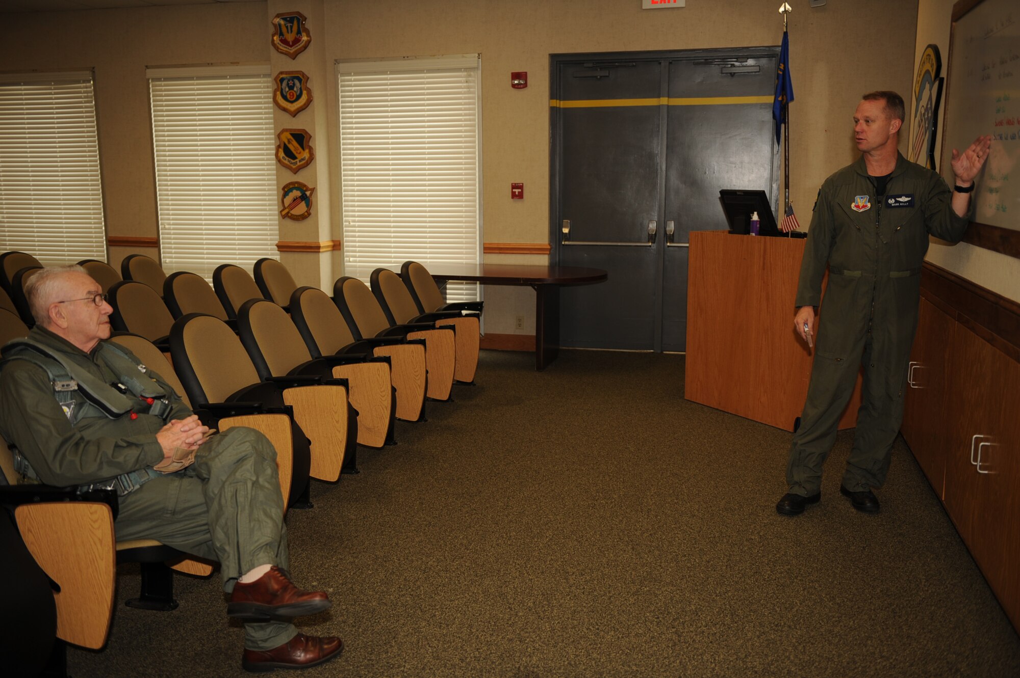 Col. Mark Kelly, 4th Fighter Wing commander, briefs Elmer Bryans, Retiree Activities Office director, on safety procedures before his taxi ride in an F-15E Strike Eagle on Seymour Johnson Air Force Base, N.C., Nov. 30, 2009. Mr. Bryans is a retired senior master sergeant who spent 20 years in the communication career field. (U.S. Air Force photo/Senior Airman Ciara Wymbs) 
