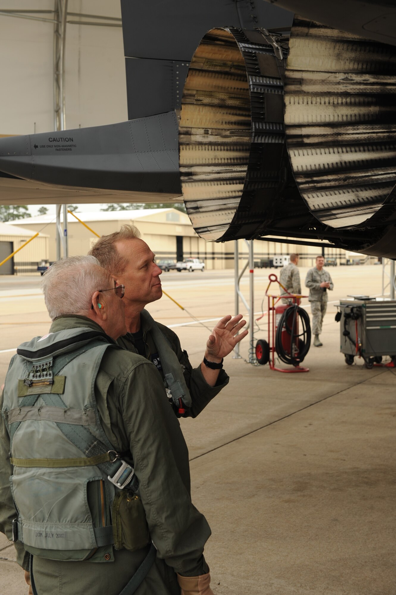 Col. Mark Kelly, 4th Fighter Wing commander, briefs Elmer Bryans, Retiree Activities Office director, on pre-flight procedure before a taxi ride in an F-15E Strike Eagle on Seymour Johnson Air Force Base, N.C., Nov. 30, 2009. Mr. Bryans is a retired senior master sergeant. He received this taxi ride for his continuous commitment to service and Seymour Johnson Air Force Base even in retirement. (U.S. Air Force photo/Senior Airman Ciara Wymbs) 