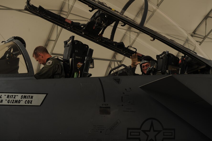 Col. Mark Kelly, 4th Fighter Wing commander, and Elmer Bryans, Retiree Activities Office director, prepare for a taxi ride in an F-15E Strike Eagle on Seymour Johnson Air Force Base, N.C., Nov. 30, 2009. Mr. Bryans, a retired senior master sergeant, received a taxi ride for his volunteerism on the base. (U.S. Air Force photo/Senior Airman Ciara Wymbs)