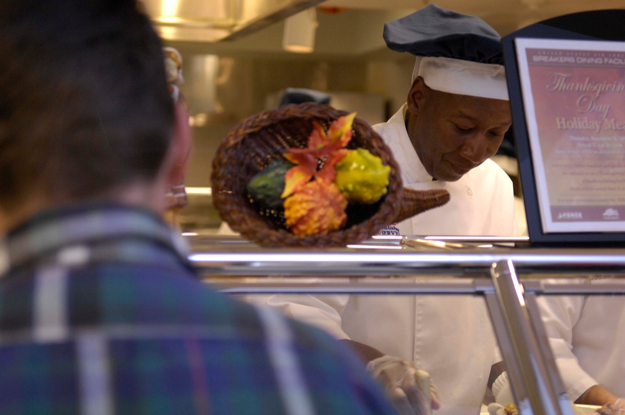 VANDENBERG AIR FORCE BASE, Calif. — Maj.  Warren “Chappy” Watties, a 30th Space Wing chaplain, serves patrons at Breakers Dining Facility for Vandenberg’s Thanksgiving Luncheon, November 26, 2009. Chappy Watties volunteered his holiday morning and early afternoon to serve thanksgiving meals to the Airman and their families. (U.S. Air Force photo/ Airman 1st Class Lael Huss)