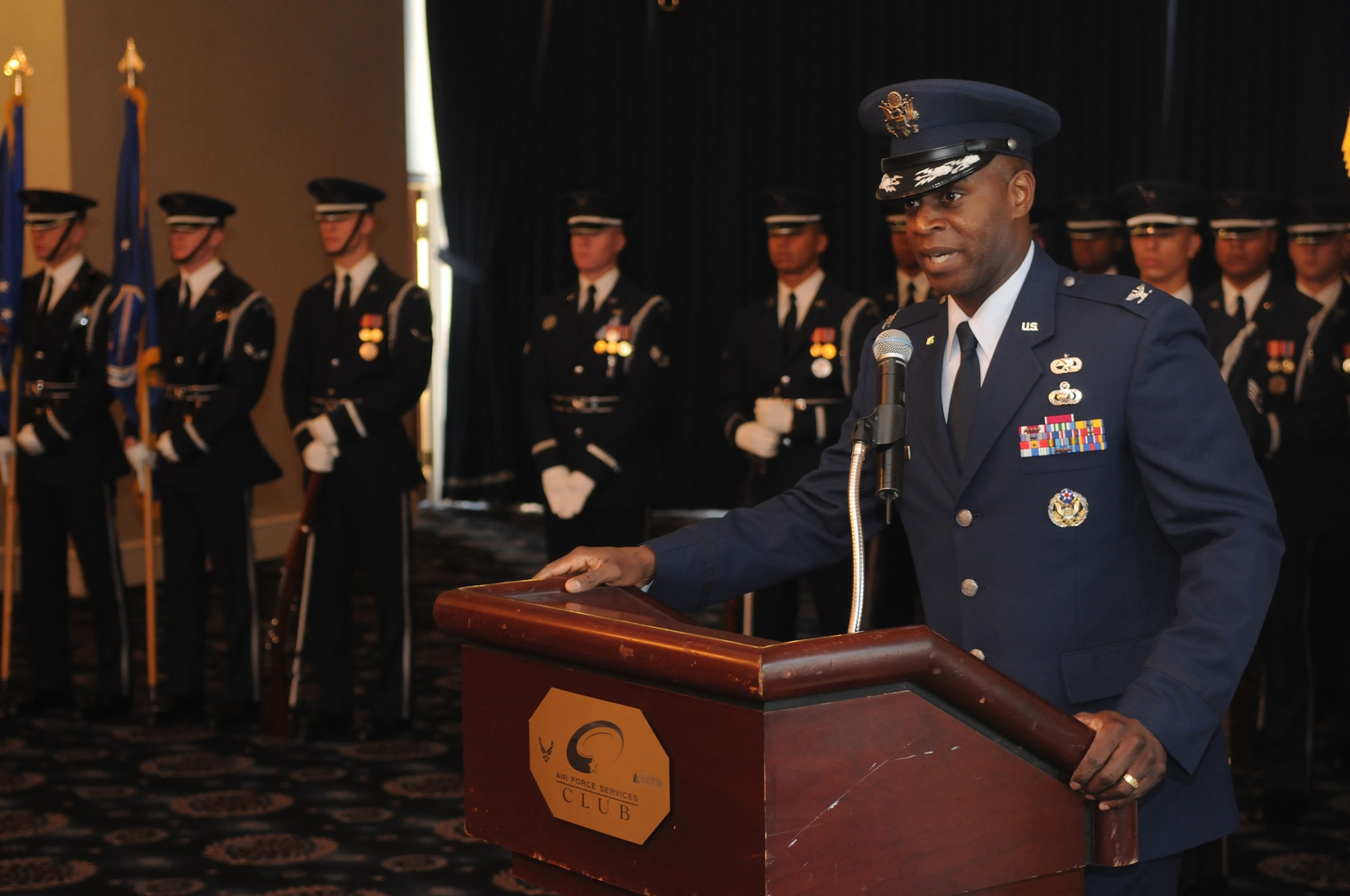 New 11th Wing Commander Col. Cedric D. Jones addresses the men and women of Bolling Air Force Base in an assumption of command ceremony Dec. 1 at the Bolling Club.  These ceremonies represent the formal assumption of responsibility, authority and accountability of command of the unit. (U.S. Air Force photo by Senior Airman Sean Adams)
