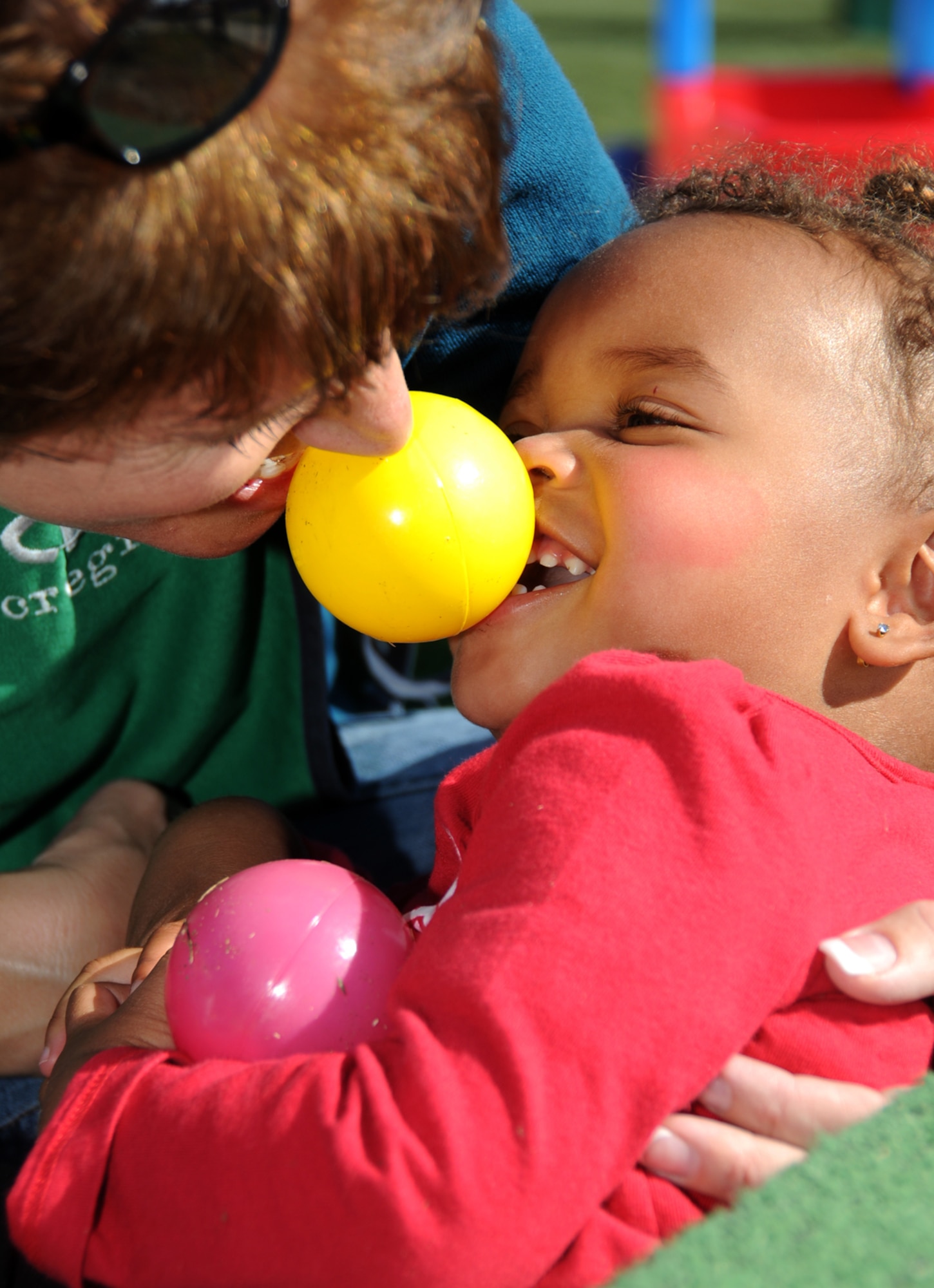 Child development center staffer Teri Johnsrud plays with her 1-year-old daughter, Tori Pearson, during the center’s Family Fun Day Nov. 19.  Tori’s dad is Senior Master Sgt. Tony Pearson, 334th Training Squadron.  (U.S. Air Force photo by Kemberly Groue)