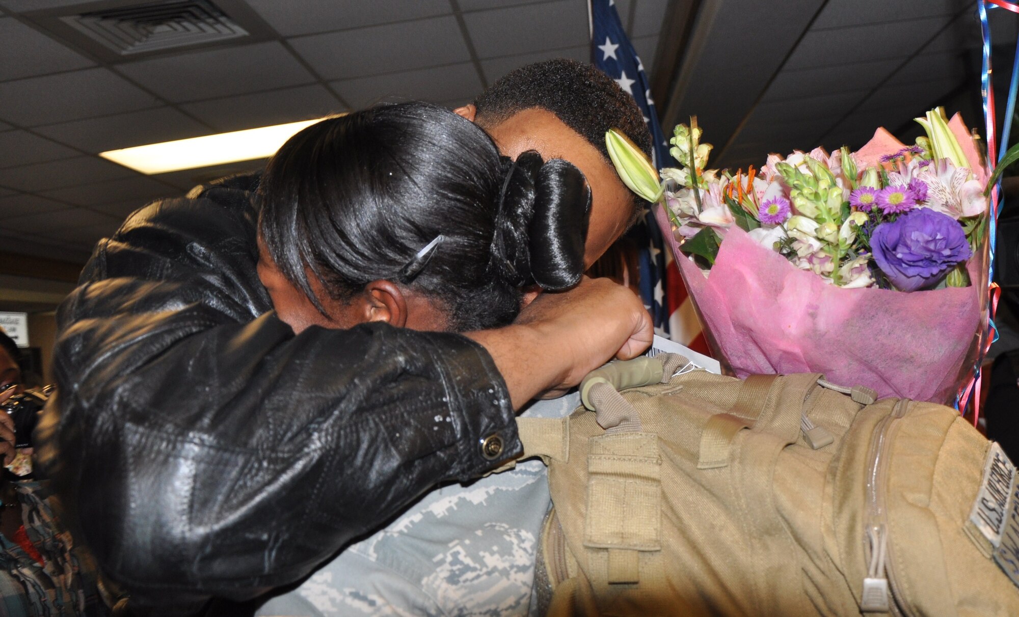 Husband Kever Swafford hugs his wife Staff Sgt. Lillie Swafford, an 82nd Security Forces member, for the first time in six months Nov. 25 at the Wichita Falls Municipal Airport. Sergeant Swafford was one of 13 Airmen in the squadron that returned from a deployment to Southwest Asia. (U.S. Air Force photo/Airman 1st Class Candy Miller)