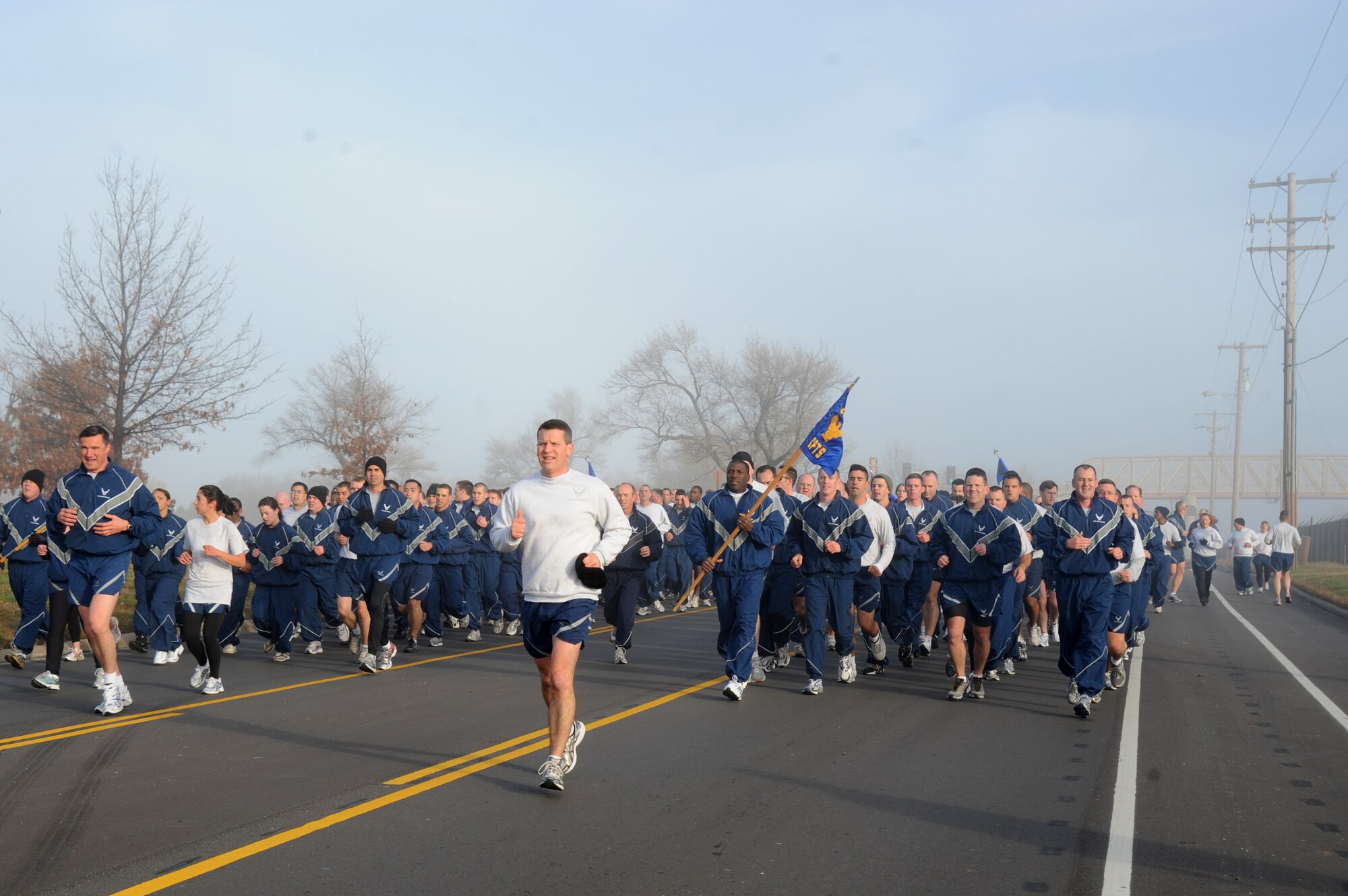 Col. Jamie Crowhurst, 22nd Air Refueling Wing commander, leads a wing run, Nov. 23, 2009, at McConnell Air Force Base, Kan. The wing kicked off Wingman Day with a 2.2 mile run. Wingman day is considered a time for Airmen to communicate with one another about Airmen lifestyles and for individual work areas to enhance teamwork and unit morale. (U.S. Air Force photo by Tech. Sgt. Chyrece Campbell) 