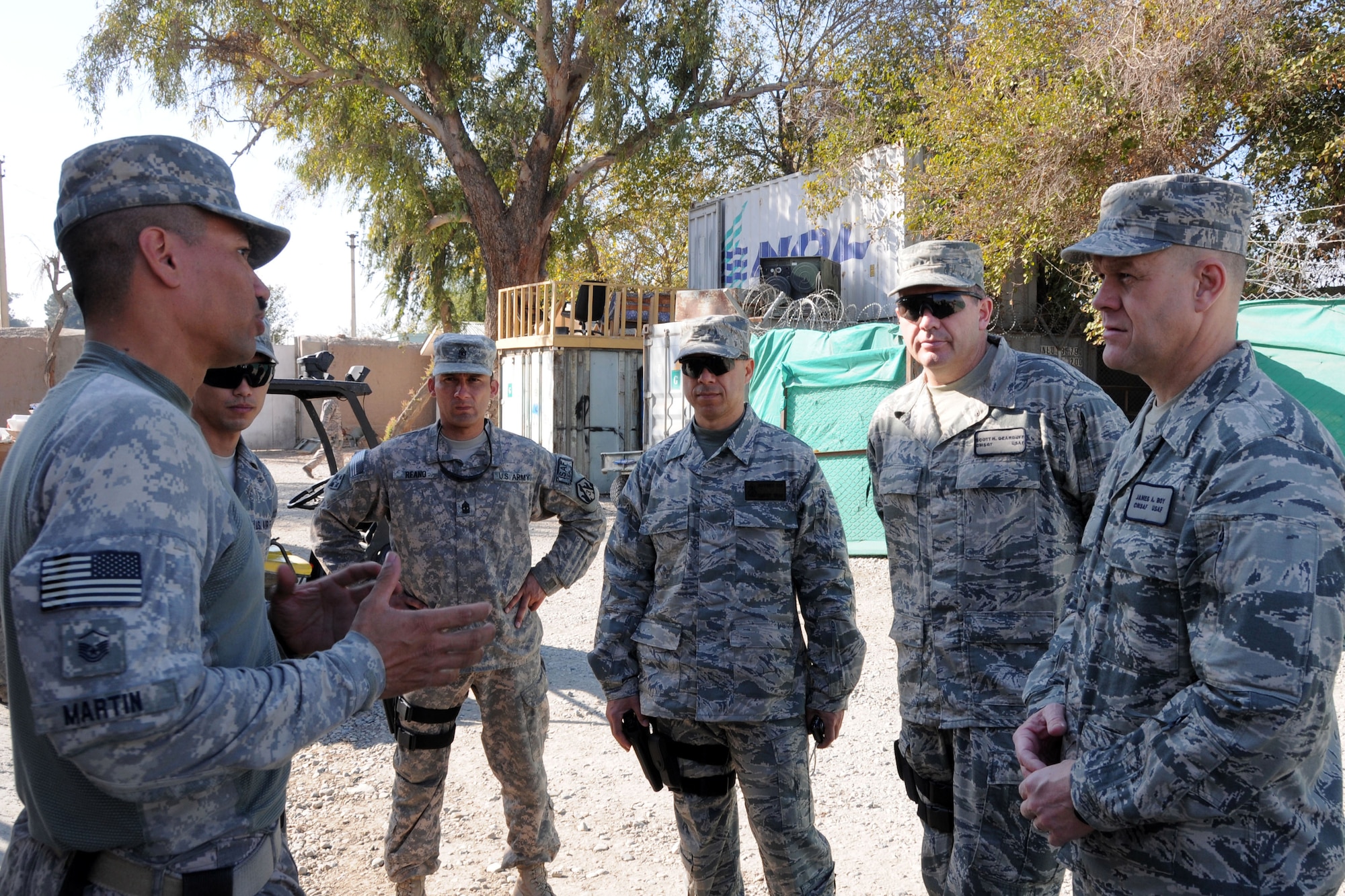 Master Sgt. Martin Lane (left) speaks to Chief Master Sgt. of the Air Force James A. Roy (right) about lessons learned and deployment process improvements Nov. 28, 2009, in Jalalabad, Afghanistan. Sergeant Lane is the Nangarhar Provincial Reconstruction Team communications superintendent deployed from Hickam Air Force Base. (U.S. Air Force photo/Tech. Sgt. Brian Boisvert)