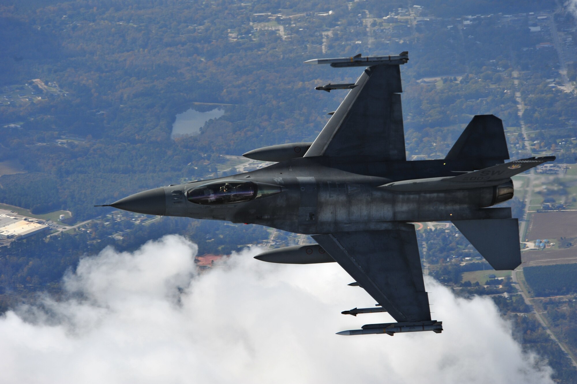 SHAW AIR FORCE BASE, S.C. -- Captain Matthew Feeman, an F-16 alert pilot from Shaw's 55th Fighter Squadron, approaches a Cessna airplane, flown by South Carolina's Civil Air Patrol, to initiate a "head butt" as part of exercise Fertile Keynote Nov. 19. A head butt is an action taken by the intercepting aircraft, after other communications like radio contact have failed, to redirect the intruder in the appropriate direction.  According to Senior Master Sgt. William Partin, alert NCO-in-charge, the F-16s are airborne within 7 minutes and 15 seconds of the alarm sounding, on average. (U.S. Air Force photo/Senior Airman Michael Cowley)